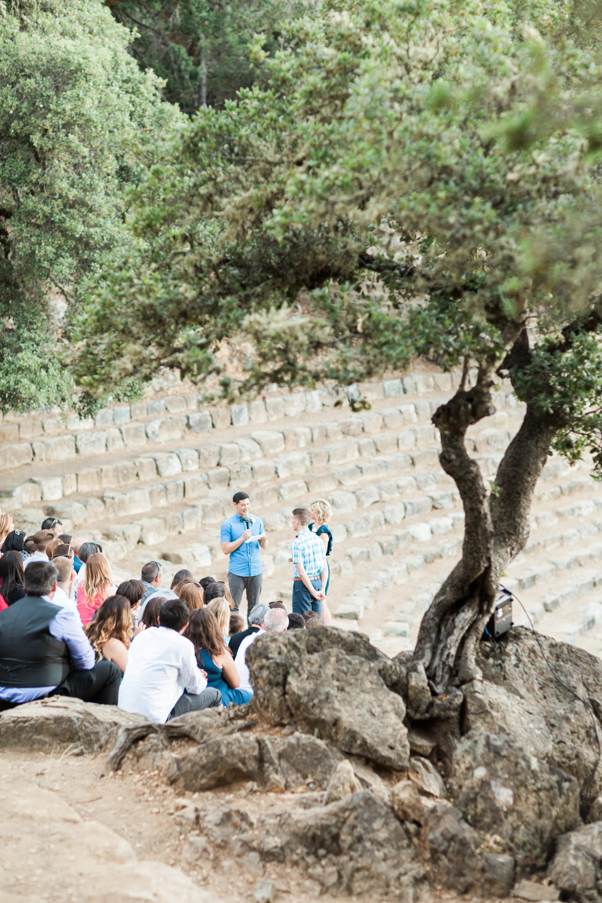 Gorgeous oak trees and big stone seats for guests to sit on
