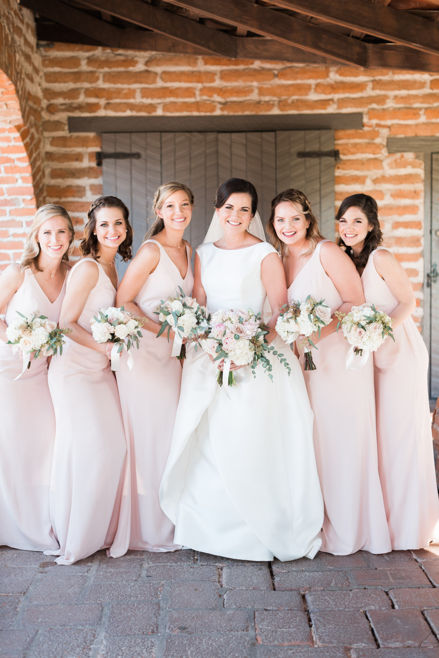 Bride with bridesmaids in blush