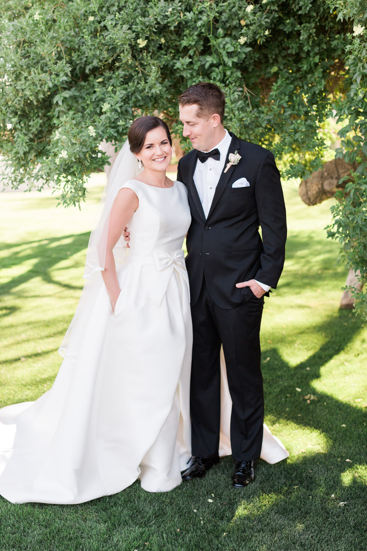 Bride & groom with hands in pockets. Wedding dress with pockets by Pronovias from Gigi Bridal