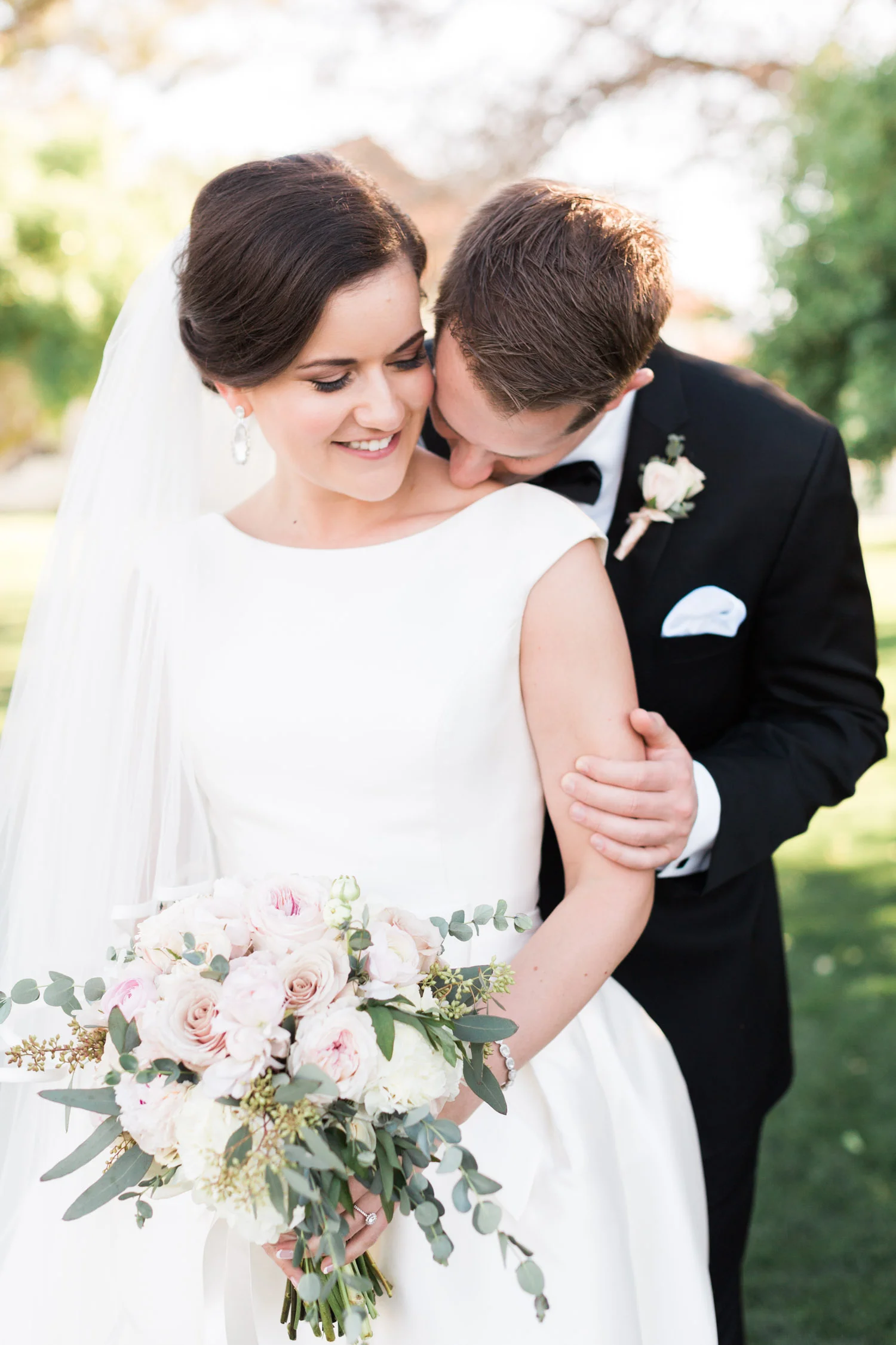 Groom kissing bride on shoulder| Betsy & John Photography | Tucson Wedding Photographers 