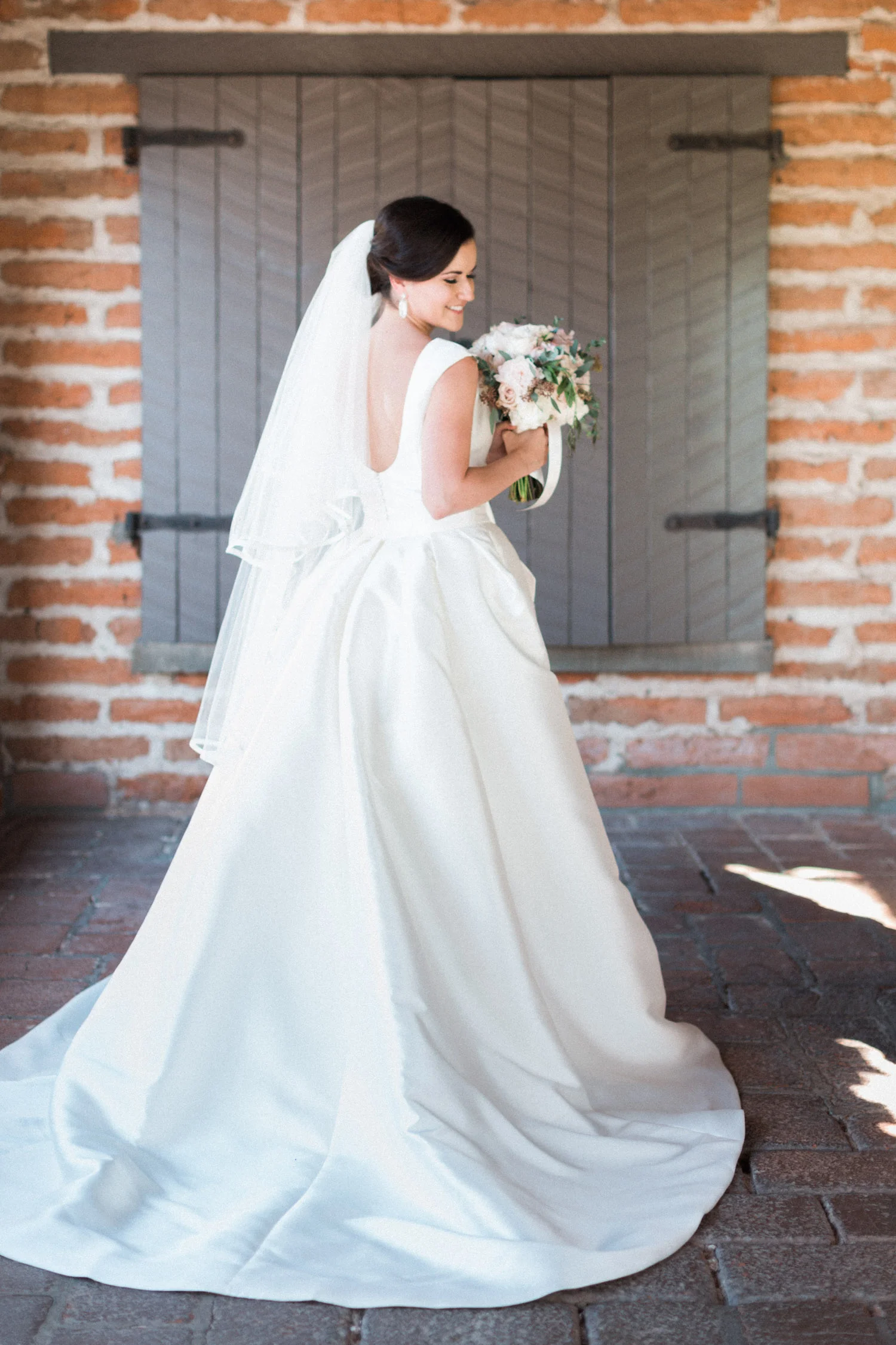 Stunning bride at Tubac golf Resort wedding in convertible Pronovias gown from Gigi Bridal | Betsy & John Photography 