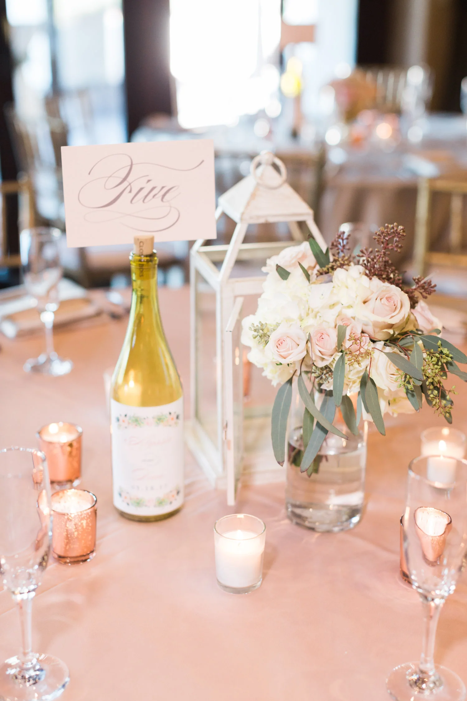 Beautiful florals by Posh Petals and table numbers by Brie Dumais Designs 