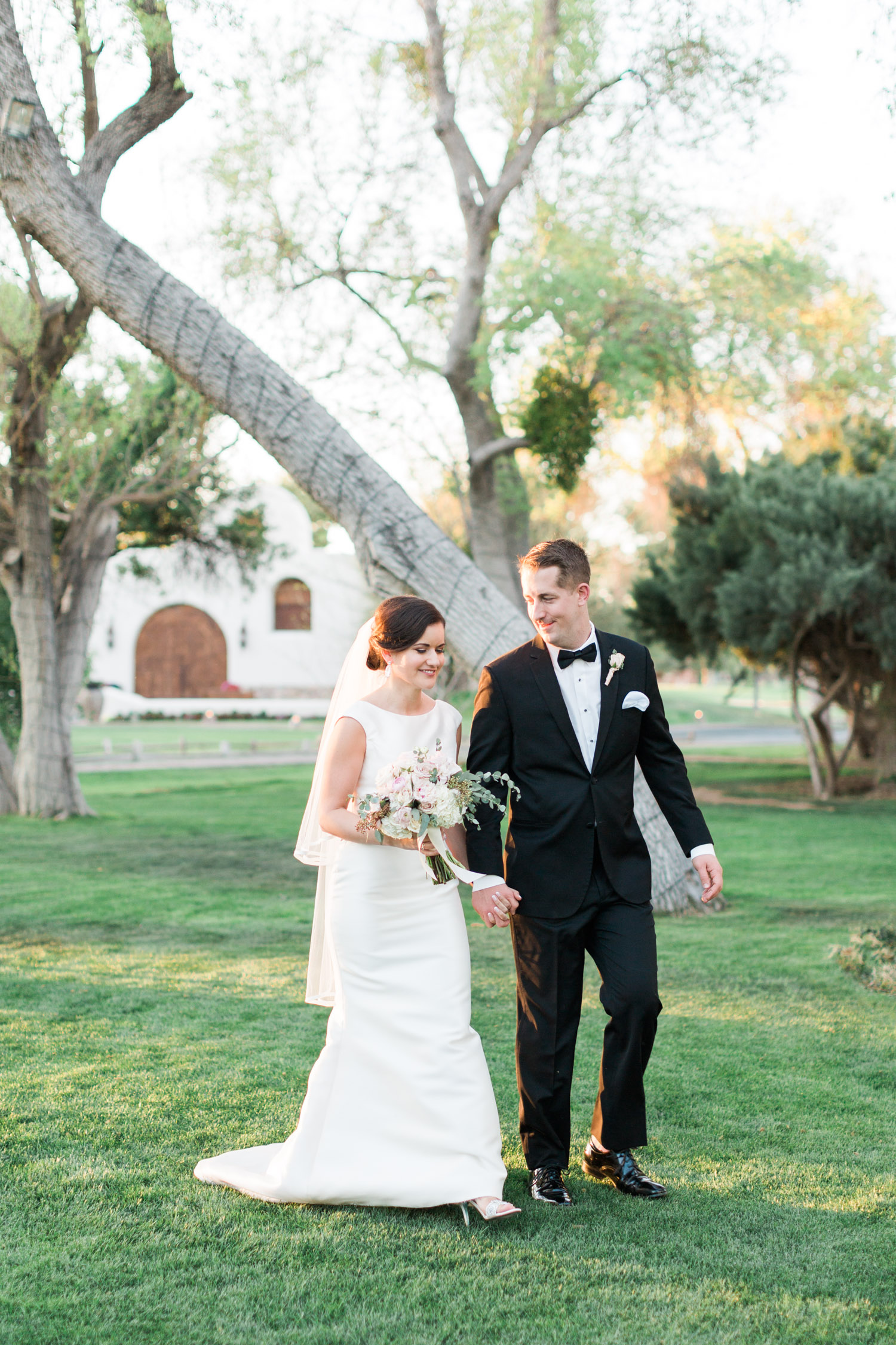 Bride and groom walking during gorgeous golden hour 