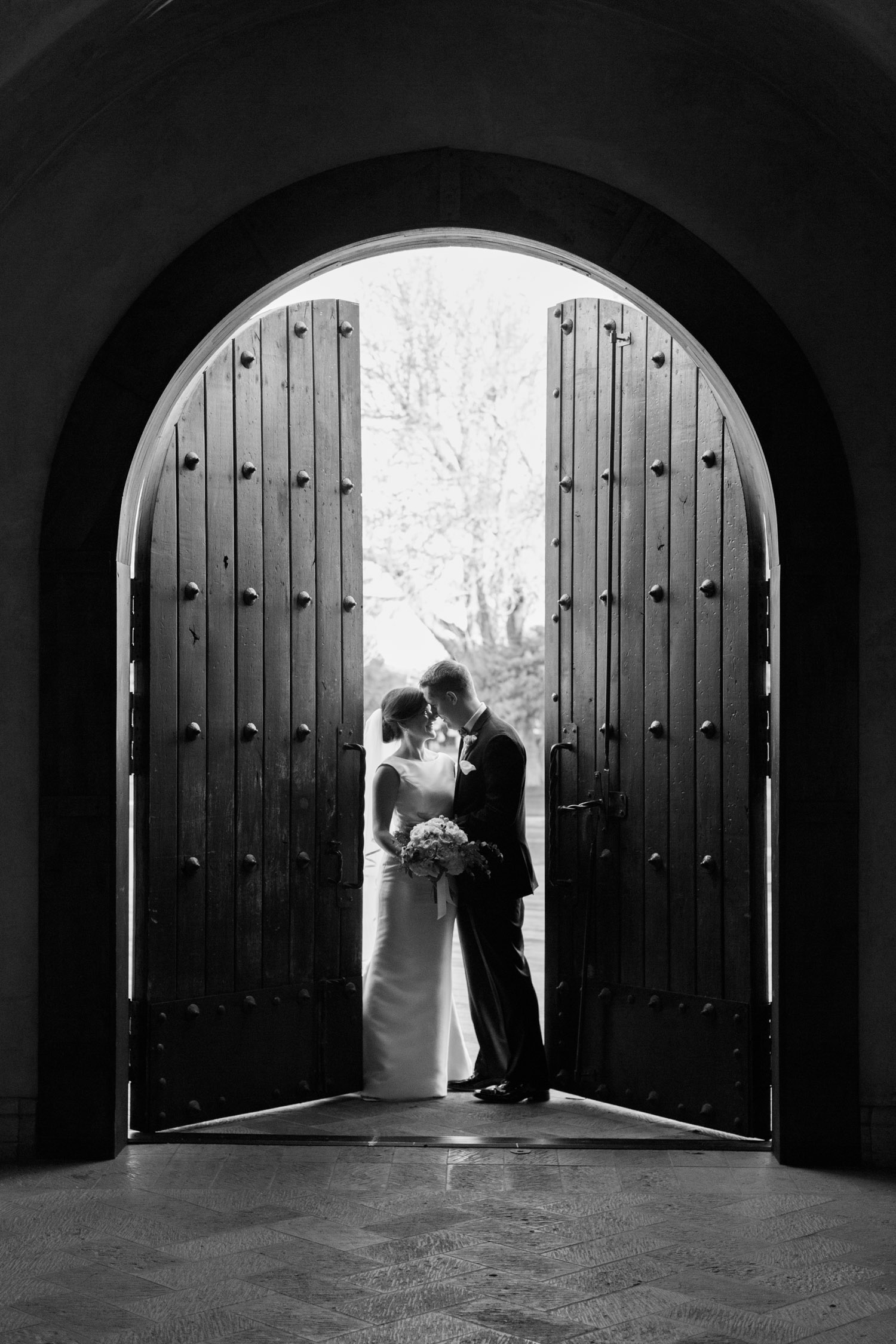 Chapel door silhouette of bride and groom 