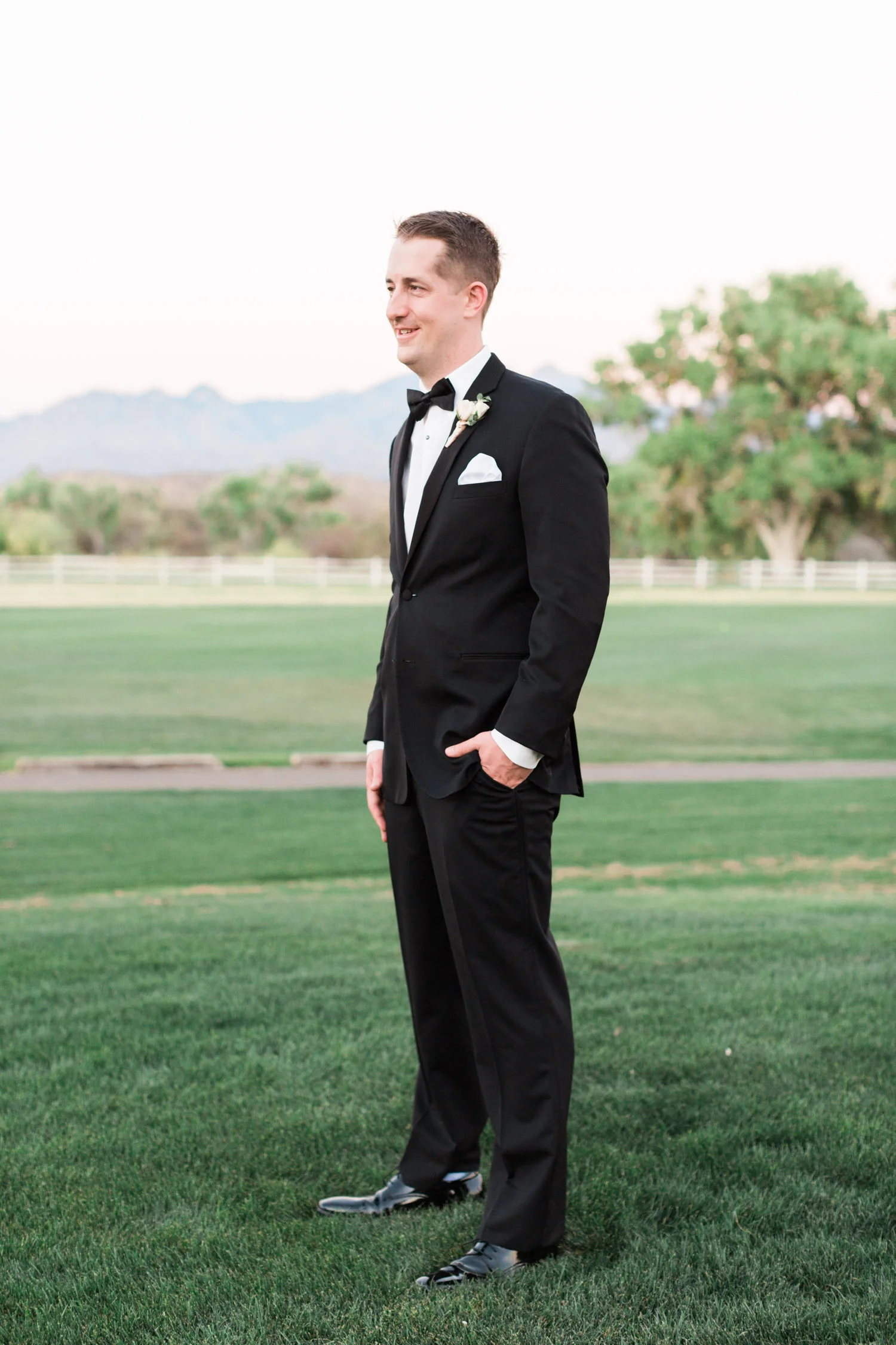 handsome groom in black tuxedo on his wedding day