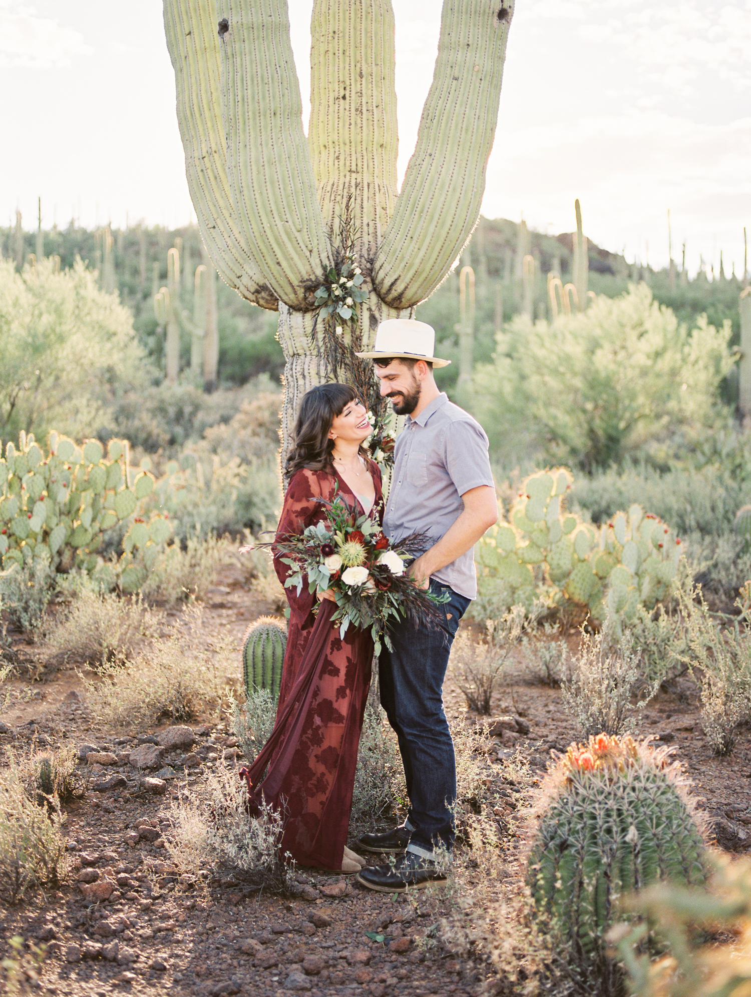 Couple smiling at each other at their desert elopement