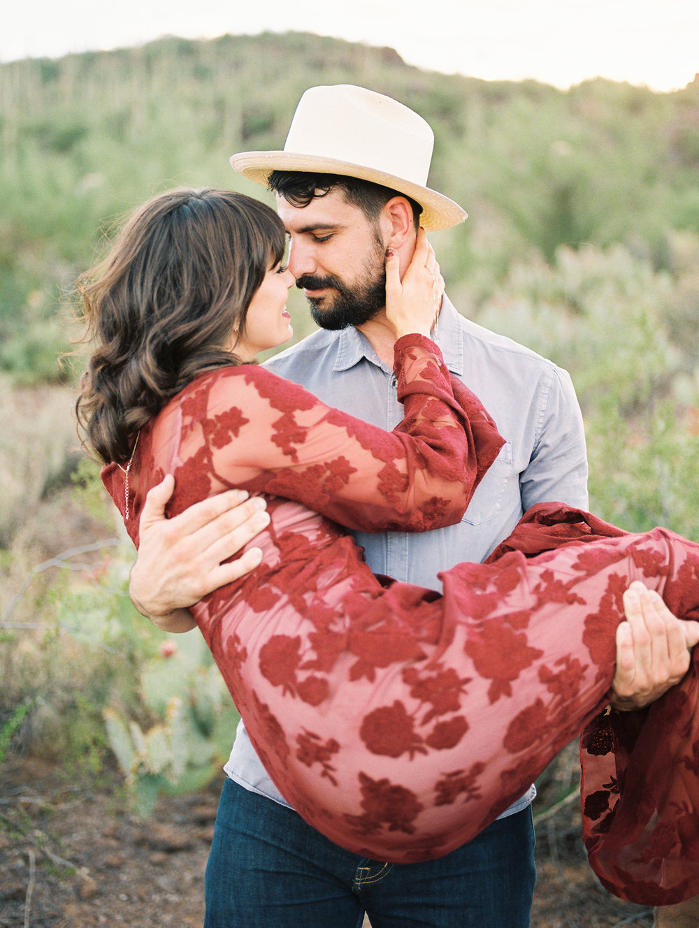  Guy holding girl at their romantic Tucson engagement session  