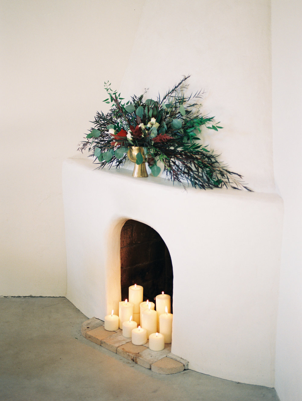  romantic white fireplace with candles burning on Portra 800 film&nbsp; 
