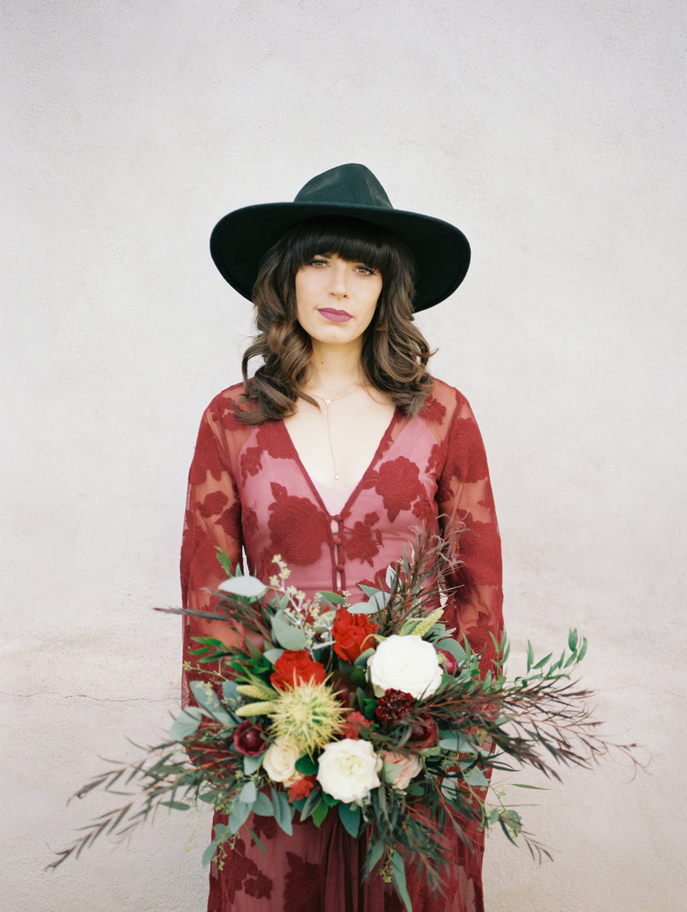  hipster bride in red wearing a black hat&nbsp; 
