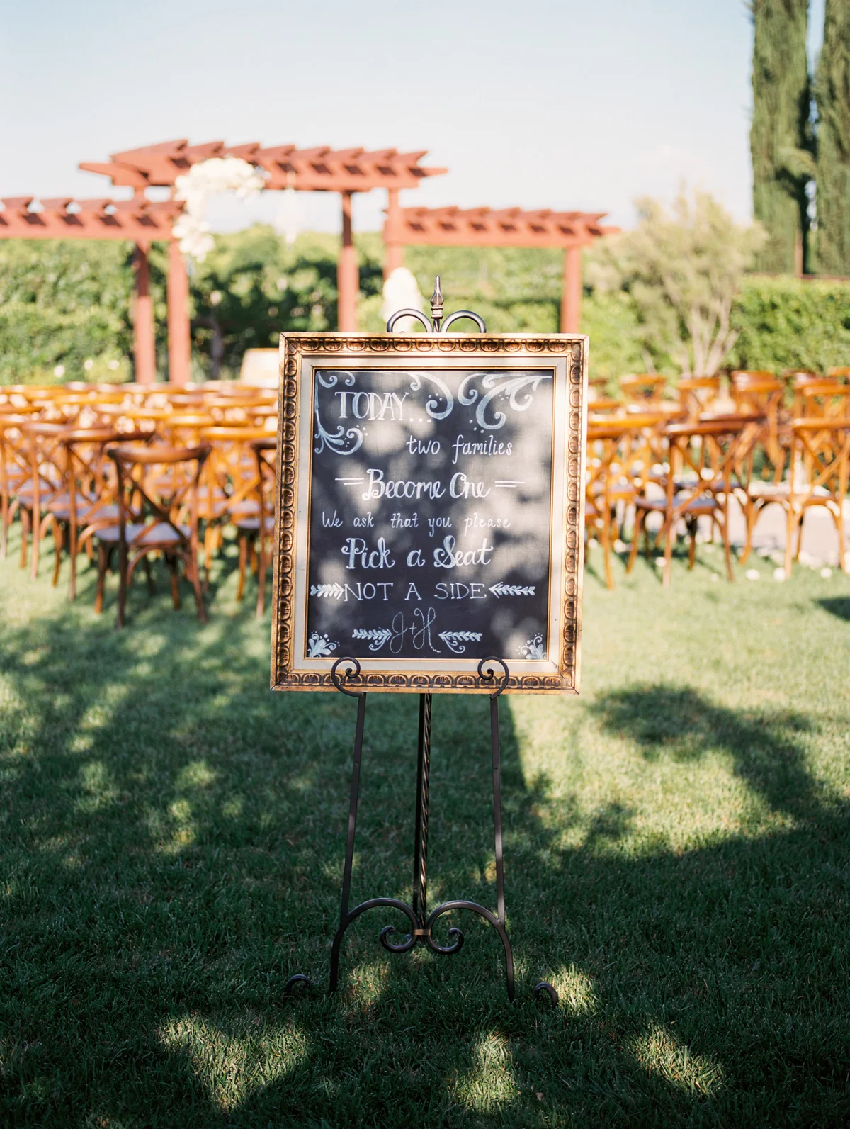 Wedding ceremony chalkboard at Harrison & Jocelyne's gorgeous Temecula wedding at Wiens Family Cellars captured by Betsy & John Photography | Temecula Film Photographers