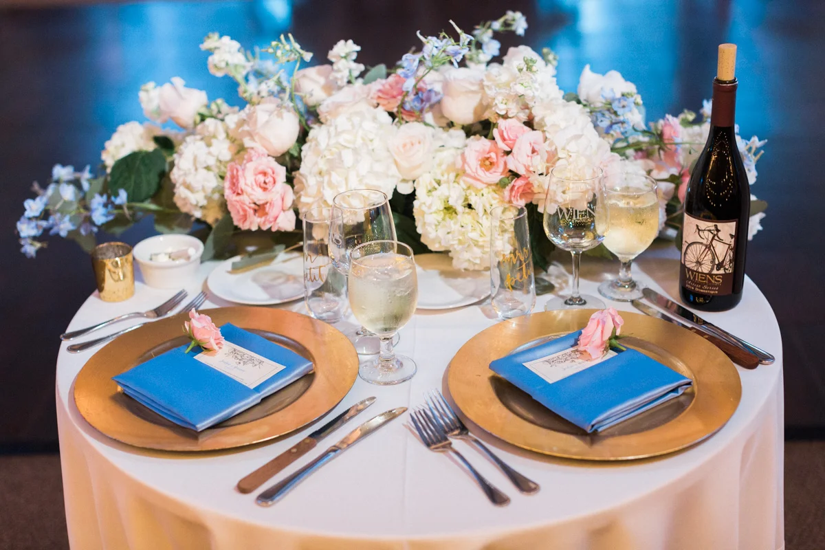 Gorgeous sweetheart table with blue and blush tones | Harrison & Jocelyne's gorgeous Temecula wedding day at Wiens Family Cellars captured by Temecula wedding photographers Betsy & John 