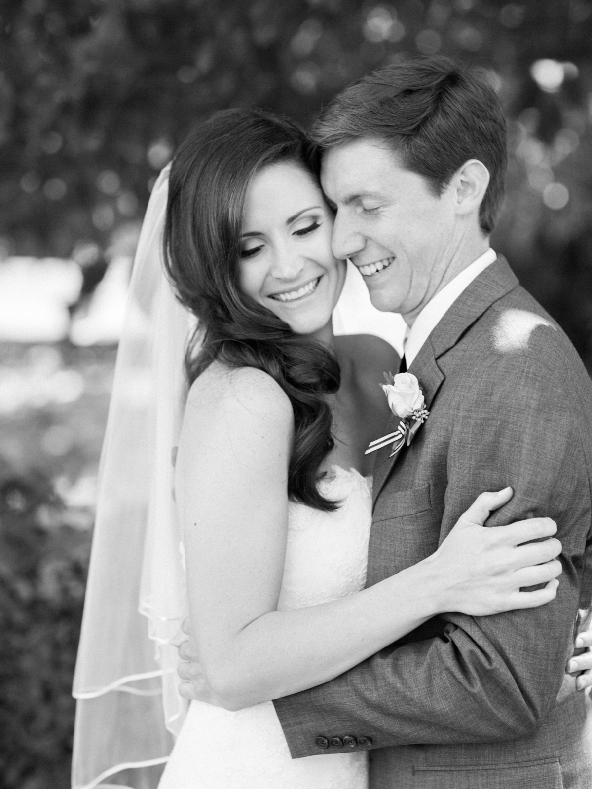 bride and groom hugging after first look
