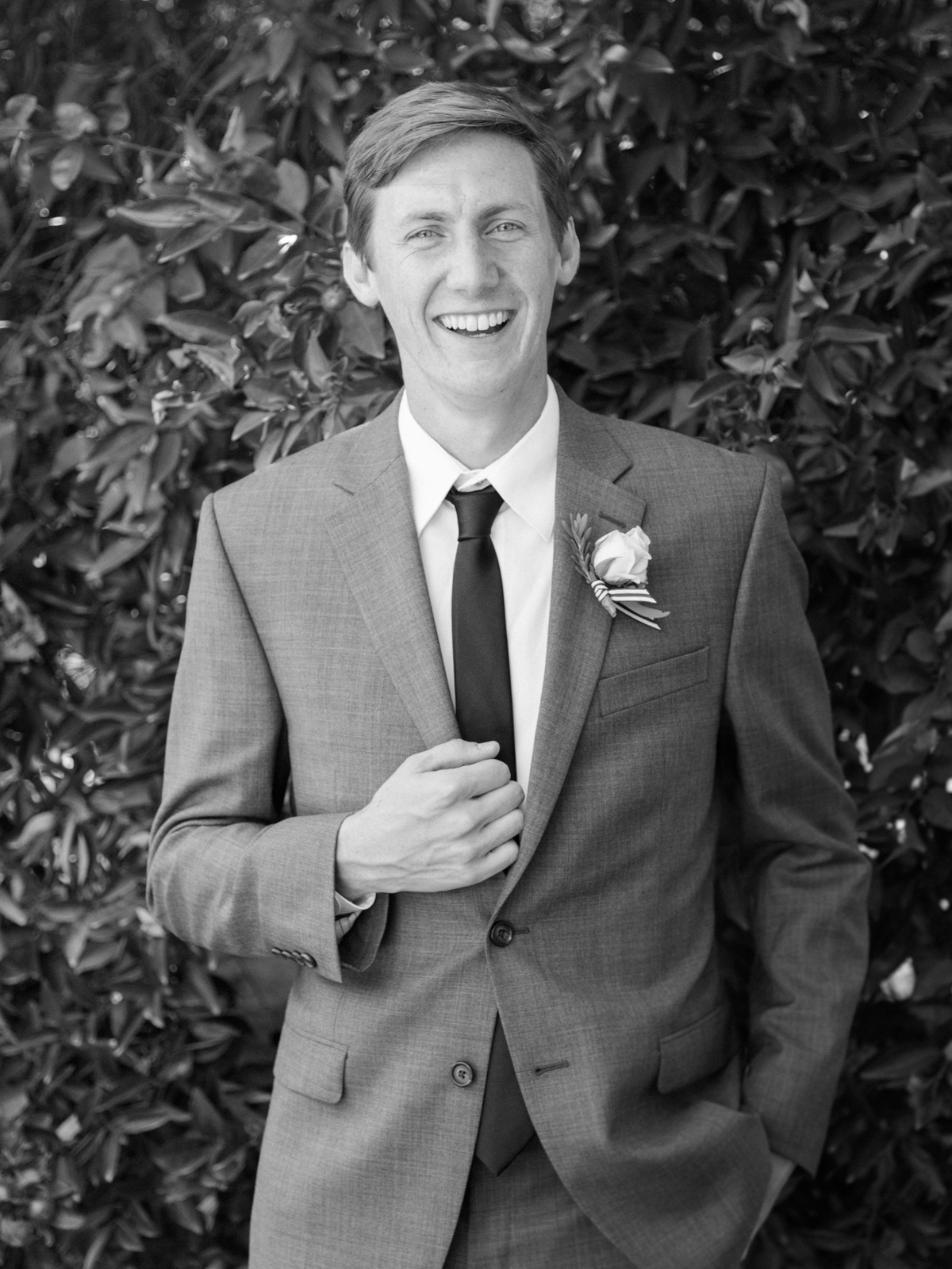 Handsome groom in black and white 