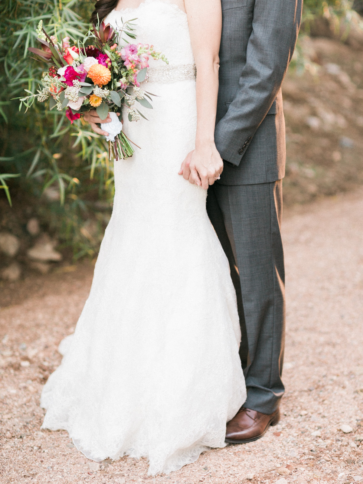 Bride and groom holding hands 