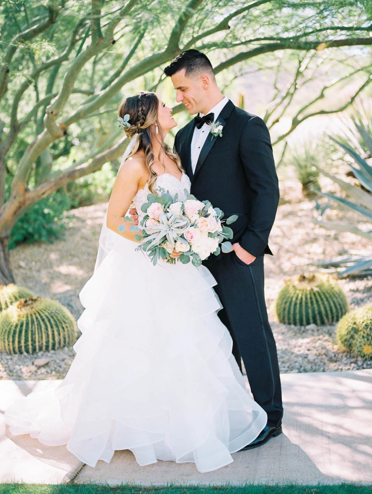 Smiling bride & groom captured by Tucson Wedding Photographers Betsy & John 