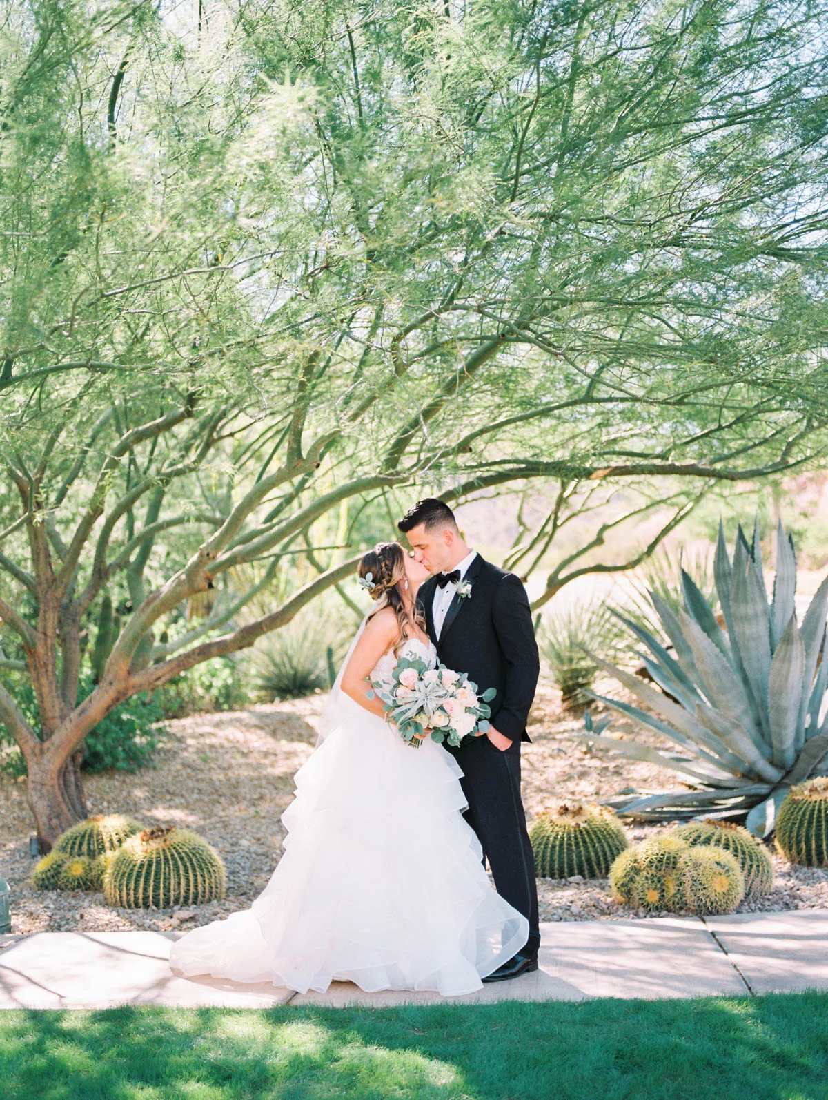 Bride & groom at JW Marriott Starr Pass captured by Tucson Wedding Photographers Betsy & John 