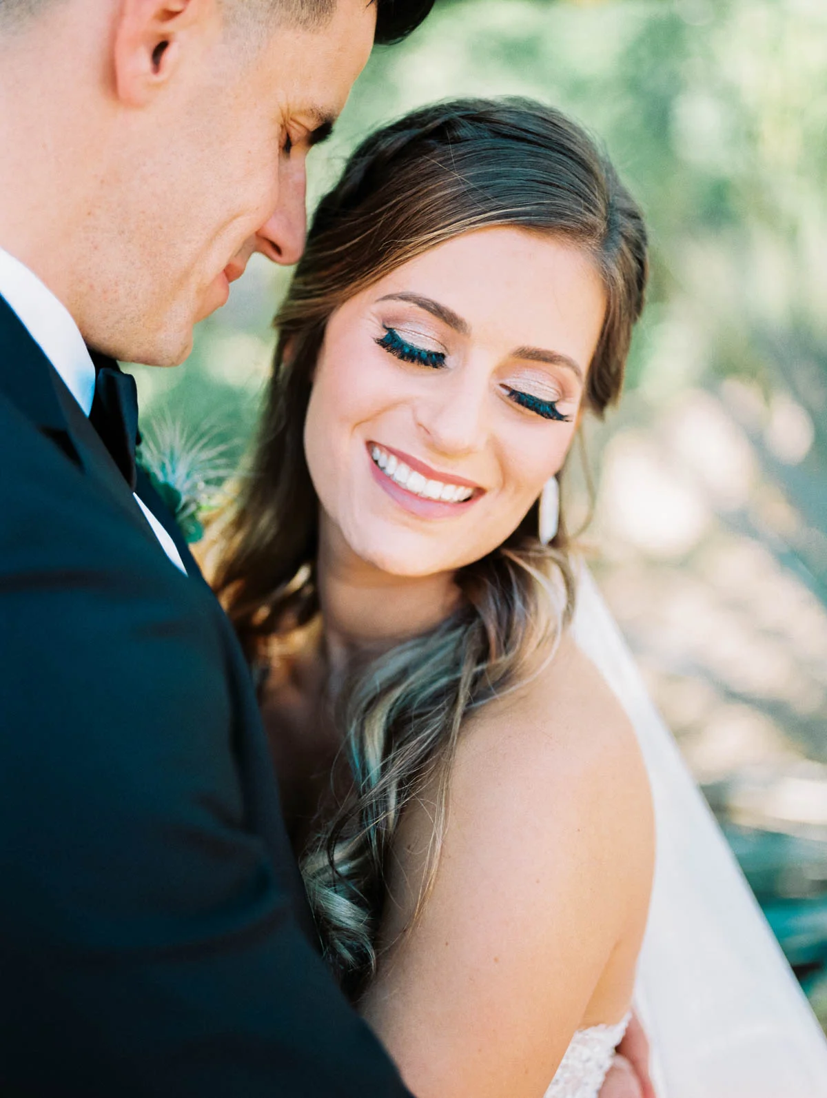 Smiling bride captured by Tucson Wedding Photographers Betsy & John 