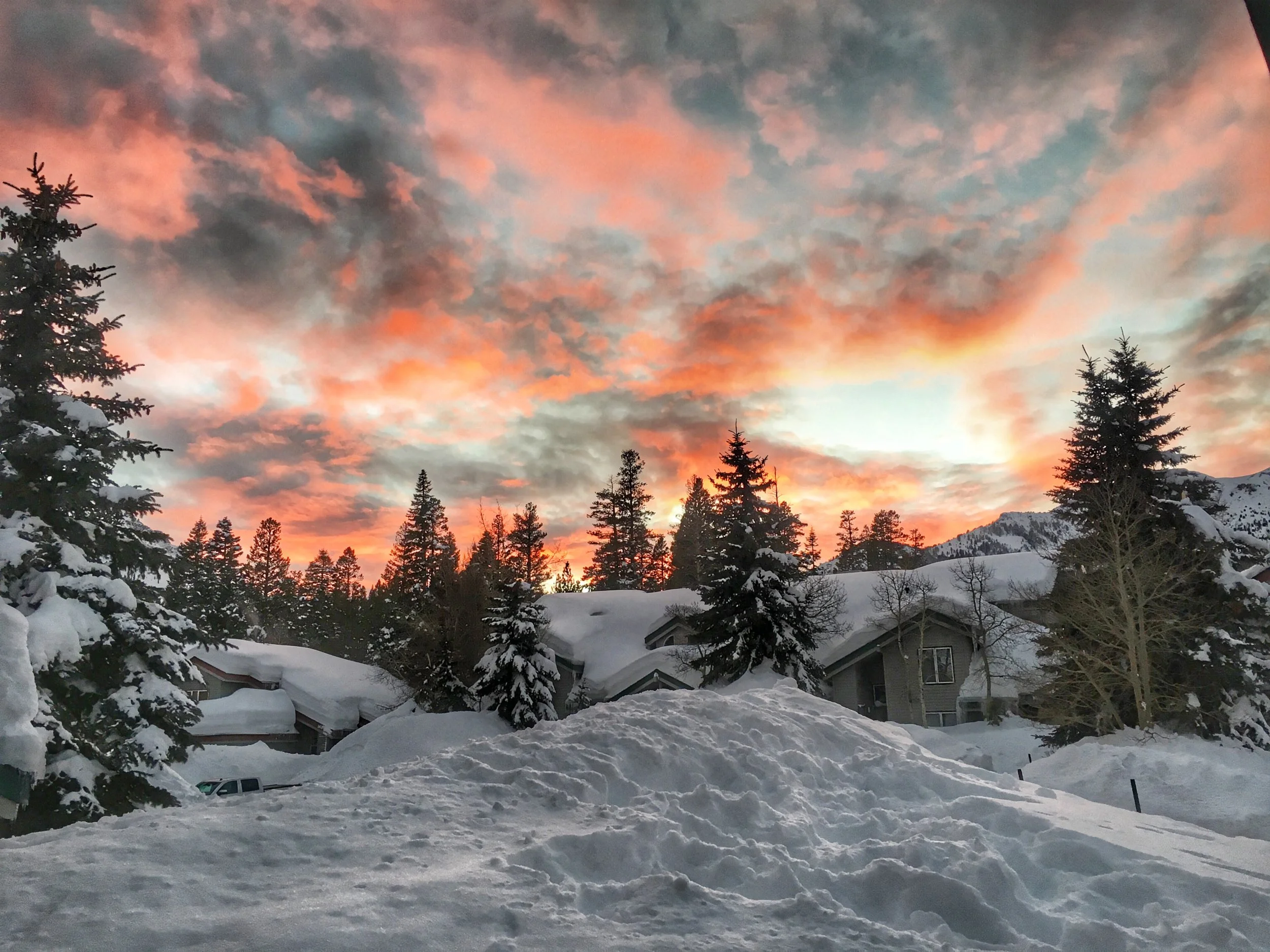 Firey sky over the snow-covered Snow Creek neighborhood in Mammoth Lakes, California.