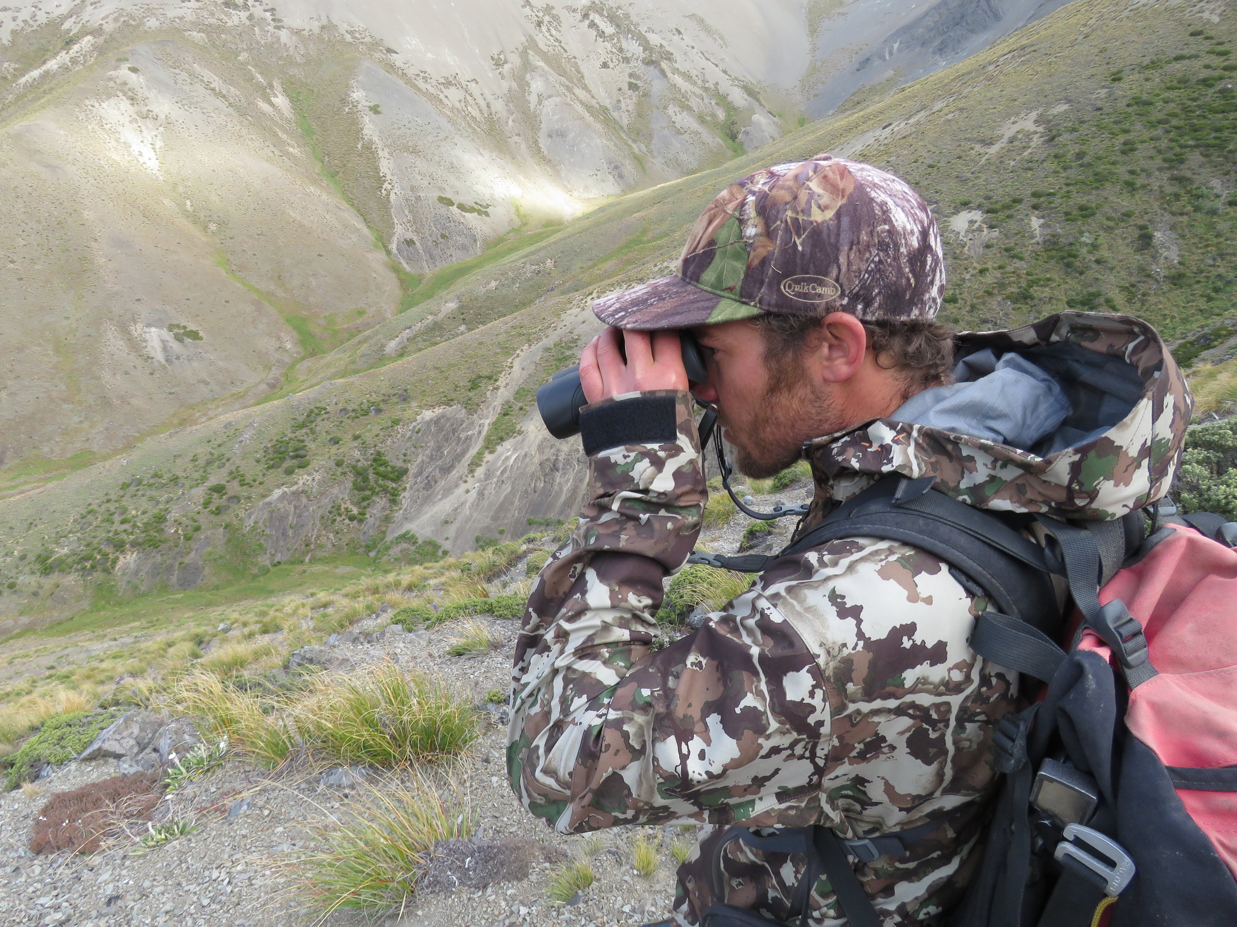  Checking out the head of the valley - Cam's wearing the Fusion camo version of the Seak  Stormtight jacket from First Lite . Having these high spec packable coats now specifically designed for hunting, has thankfully brought an end to the days of having to weather a storm in fluffy pyjamas. 