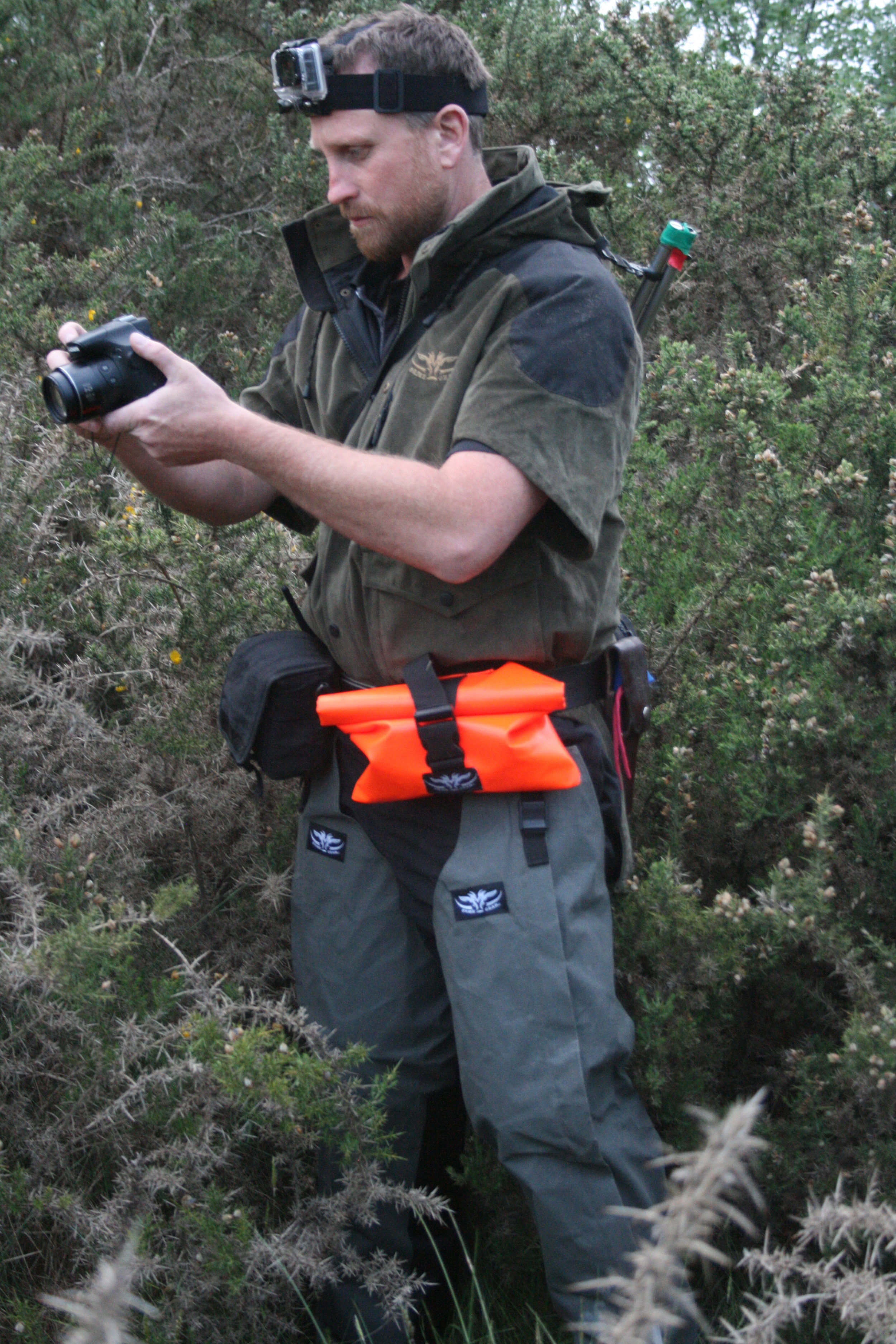 Gopro head mounted camera for when you have to get involved and the bigger video camera for those opportunities where you can sit back and let another hunter do the work.