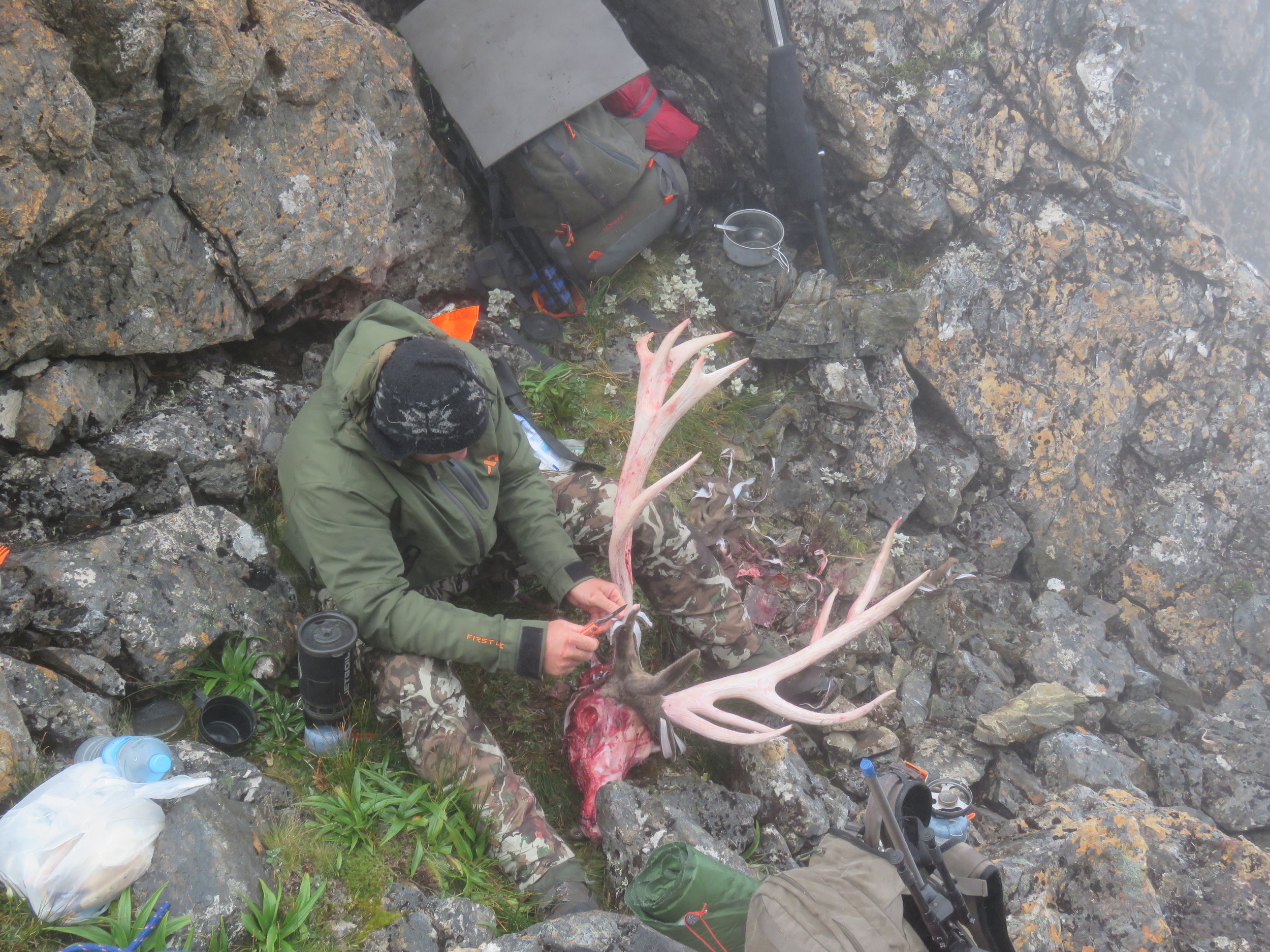Stripping the velvet off Shaun's stag while waiting for the fog to clear