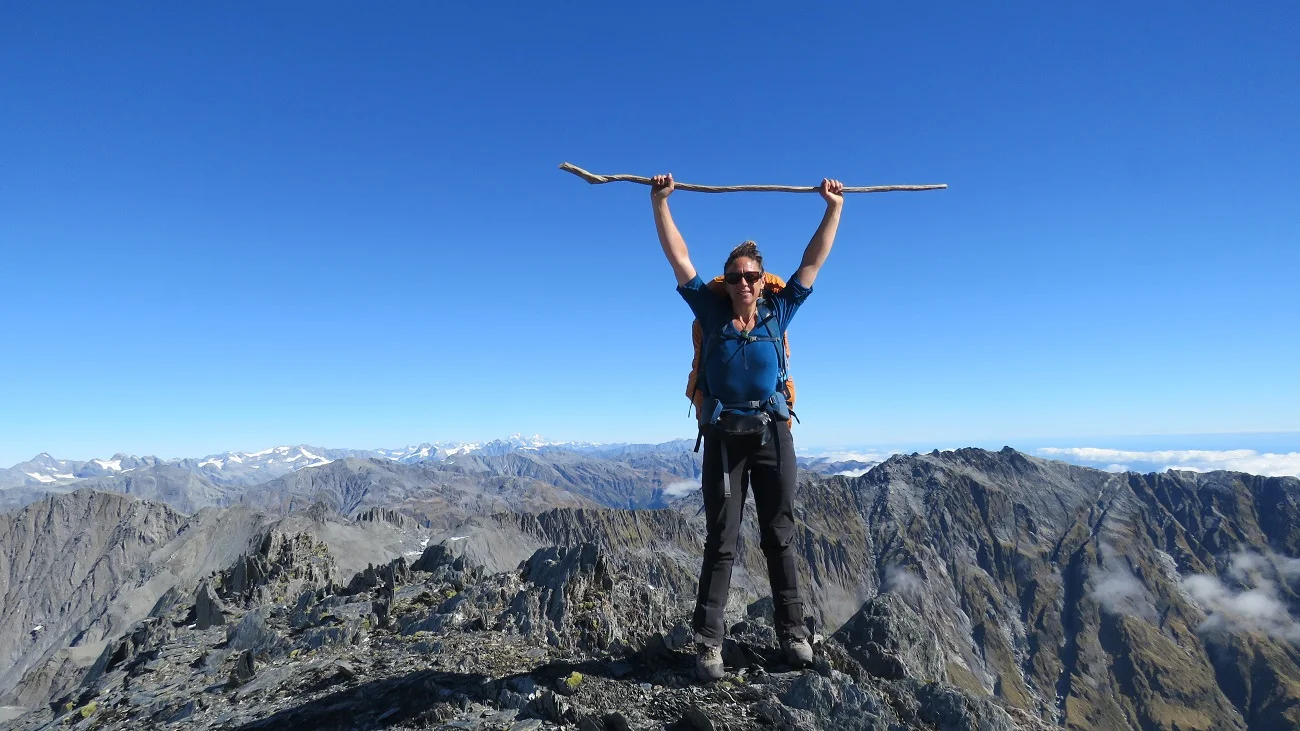 Haley stoked to finally stand on the top of Mt Beaumont after a grueling five day hike. Not a breath of wind, what a great day to cross over the range.