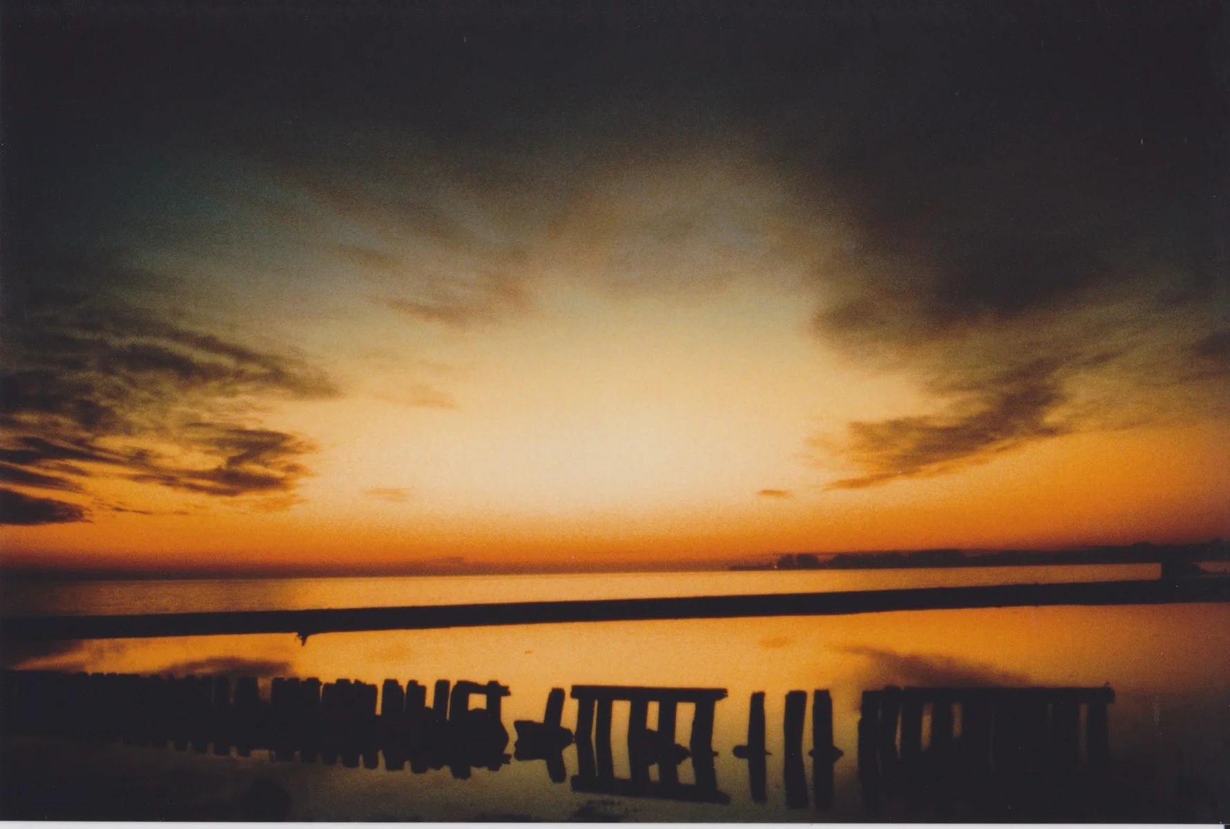  35mm film photography by Ryan Kuratomi  Sunset at Seacliff Beach in Aptos, California 