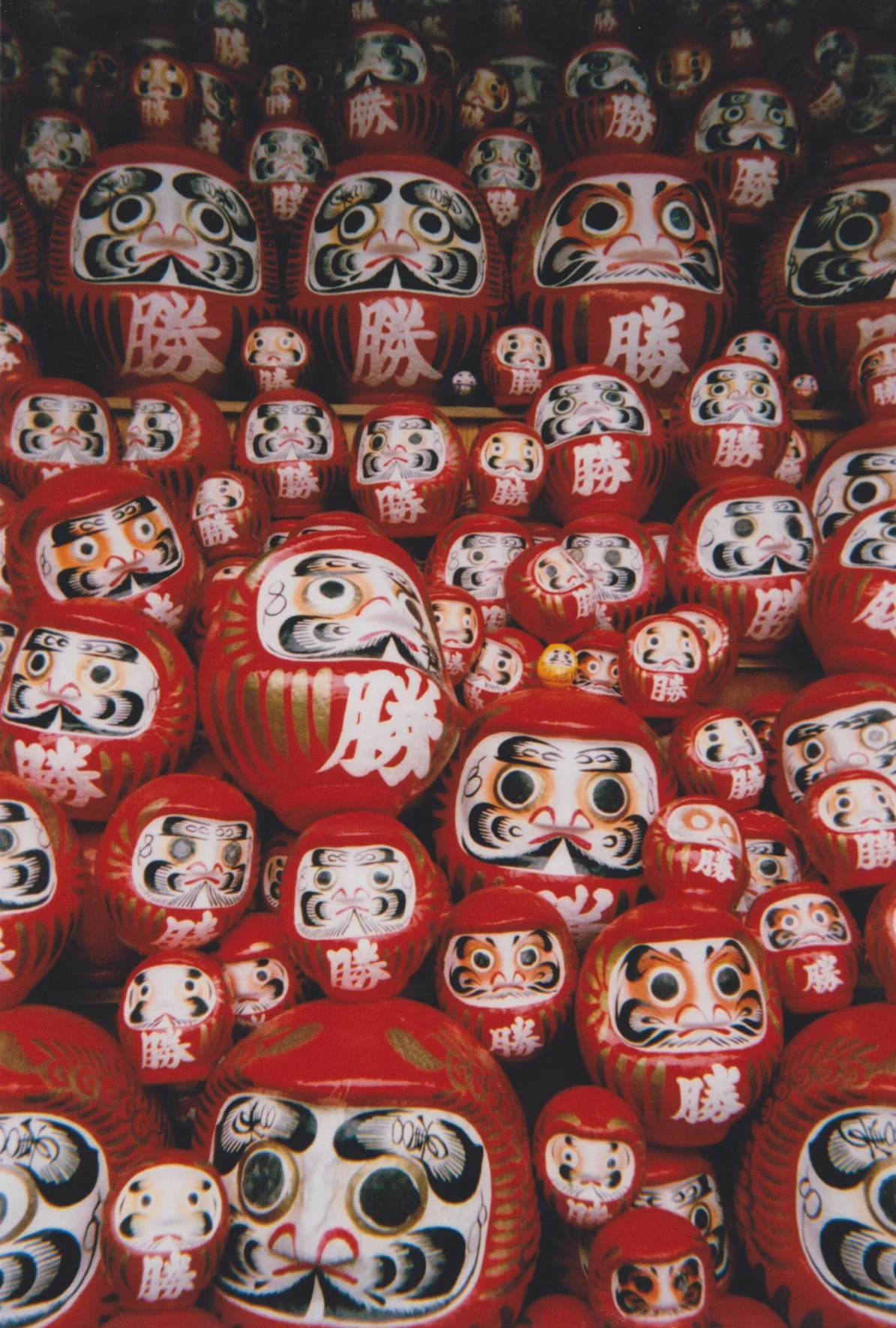  35mm film photography by Ryan Kuratomi  Daruma at Katsuoji Temple in Osaka, Japan 