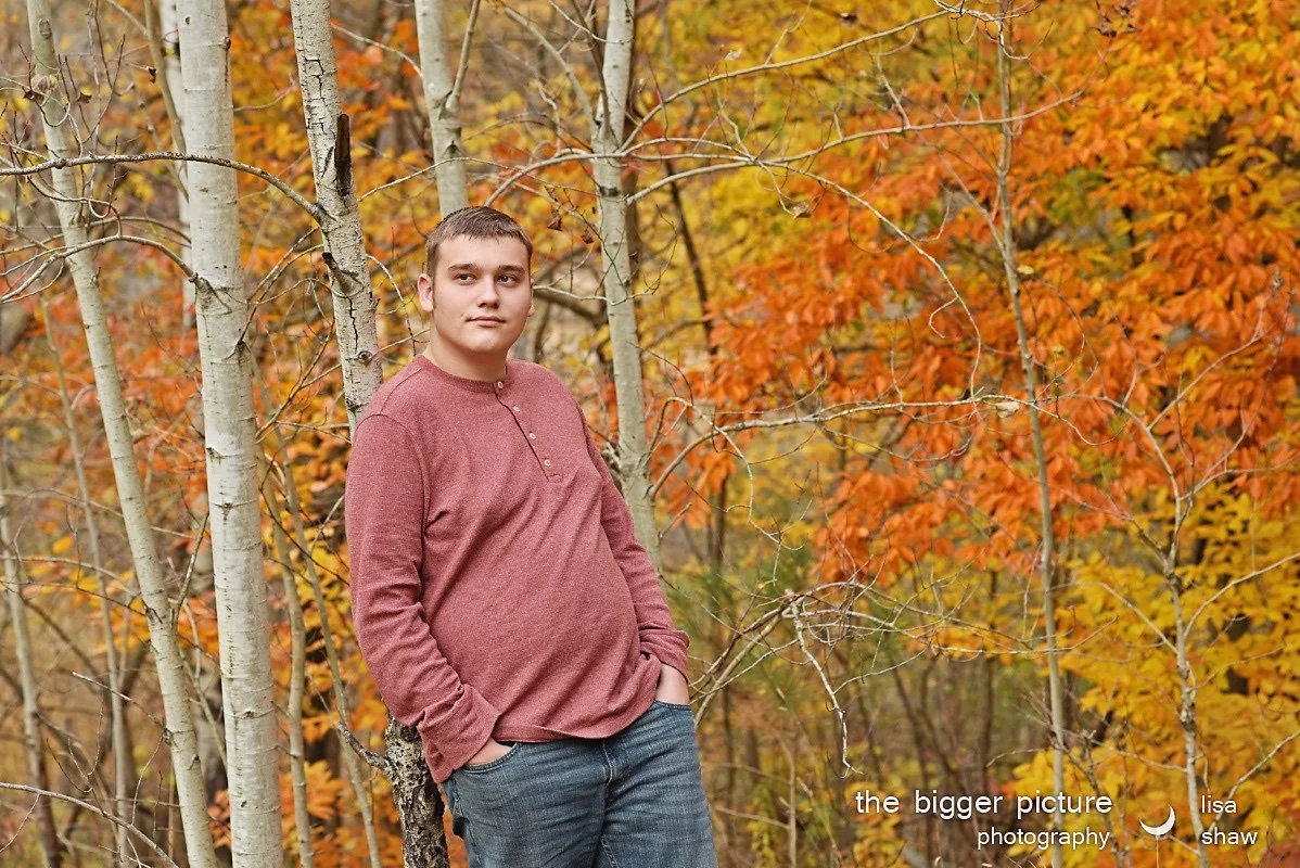 high school senior photo fall leaves and trees