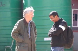Karl w/ Igshaan Samuels with water tanks in background