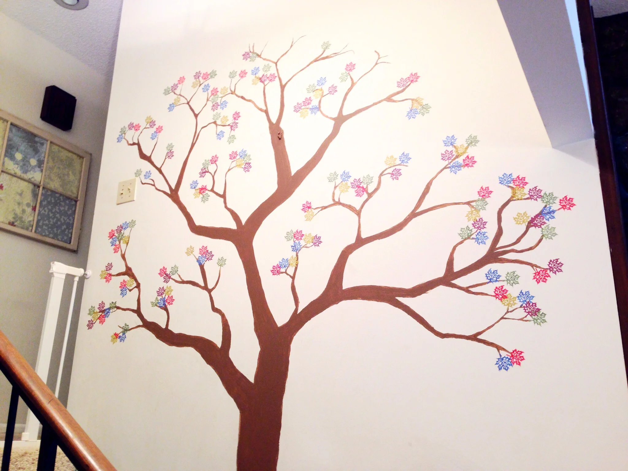  Our family tree in progress. My artist husband free-handed the tree...