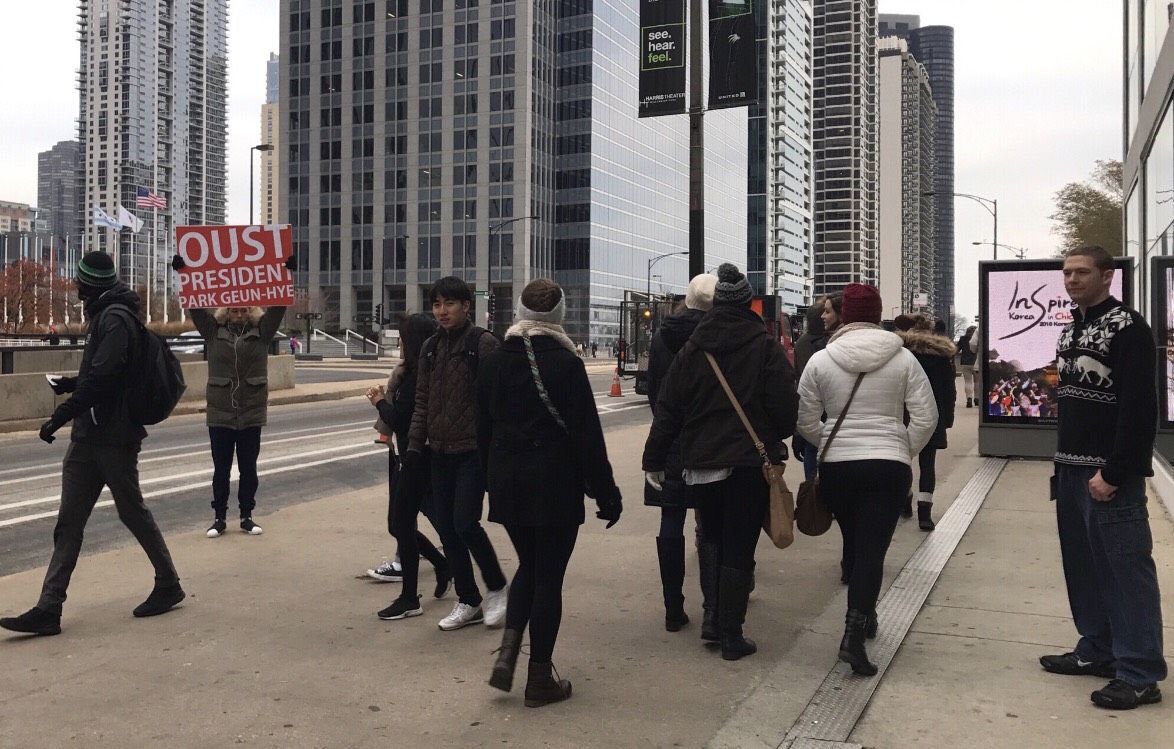 The Oust Project performance in front of Harris Theater, at the “Inspired Korea in Chicago" (event organized by the Consulate General of the Republic of Korea and Korean Cultural Center of Chicago) in December, 2016. Photograph by Da-eun Hong.
