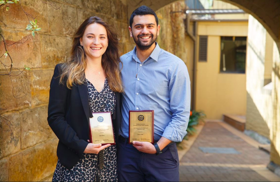 L to R: Kate Mazey and Jeremy Saad with their individual awards for Outstanding Club Marketing and Engagement.