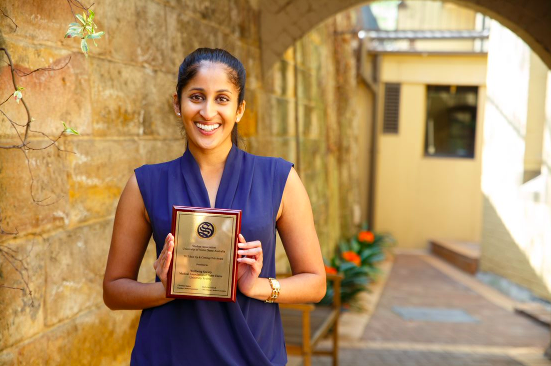 Nikita Naidu accepting the Best Up & Coming Award on behalf of the Wellbeing Society - MANDUS.