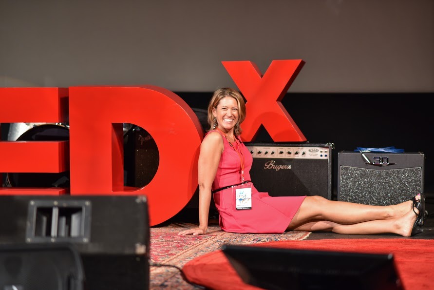 tedx_sign_sitting_closer.jpg