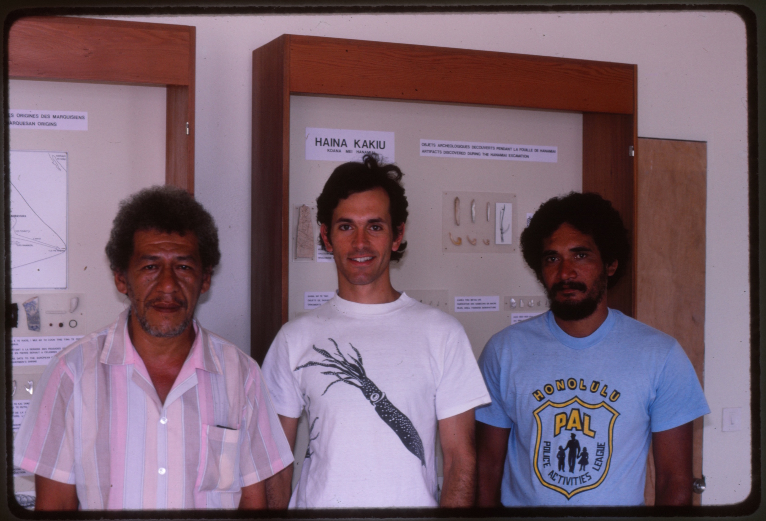 1987. T. Tetahiotupa, B. Rolett and T. Teiefitu upon completion of the original three display cases. These exhibited artifacts from the first archaeological excavations on Tahuata. (Copy)