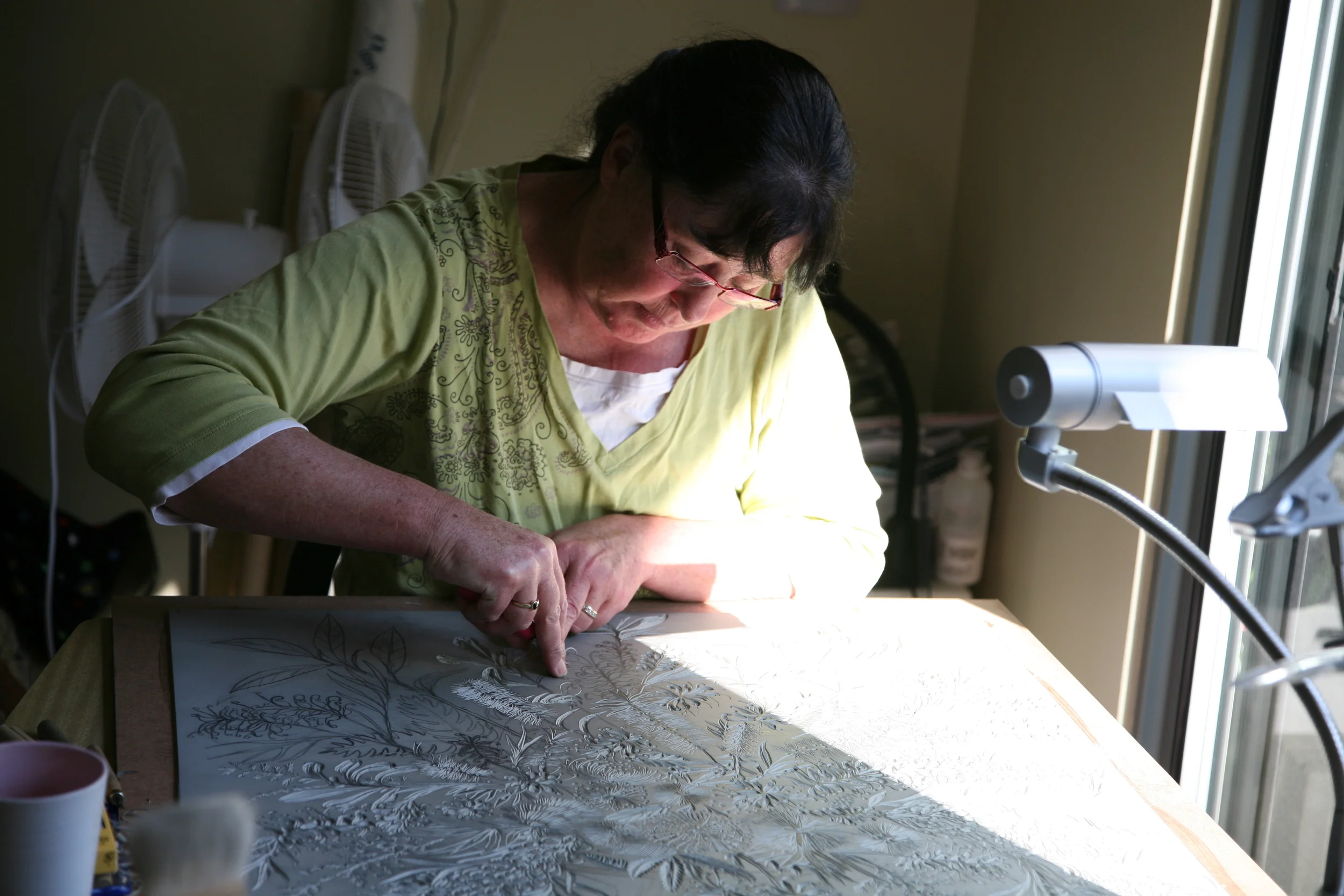  Then,&nbsp;I draw my chosen image directly onto the lino with lead pencil. I either work from a photograph of a scene (usually with trees) or, I pick a bunch of flowers from our garden and arrange them in a vase to draw them. 