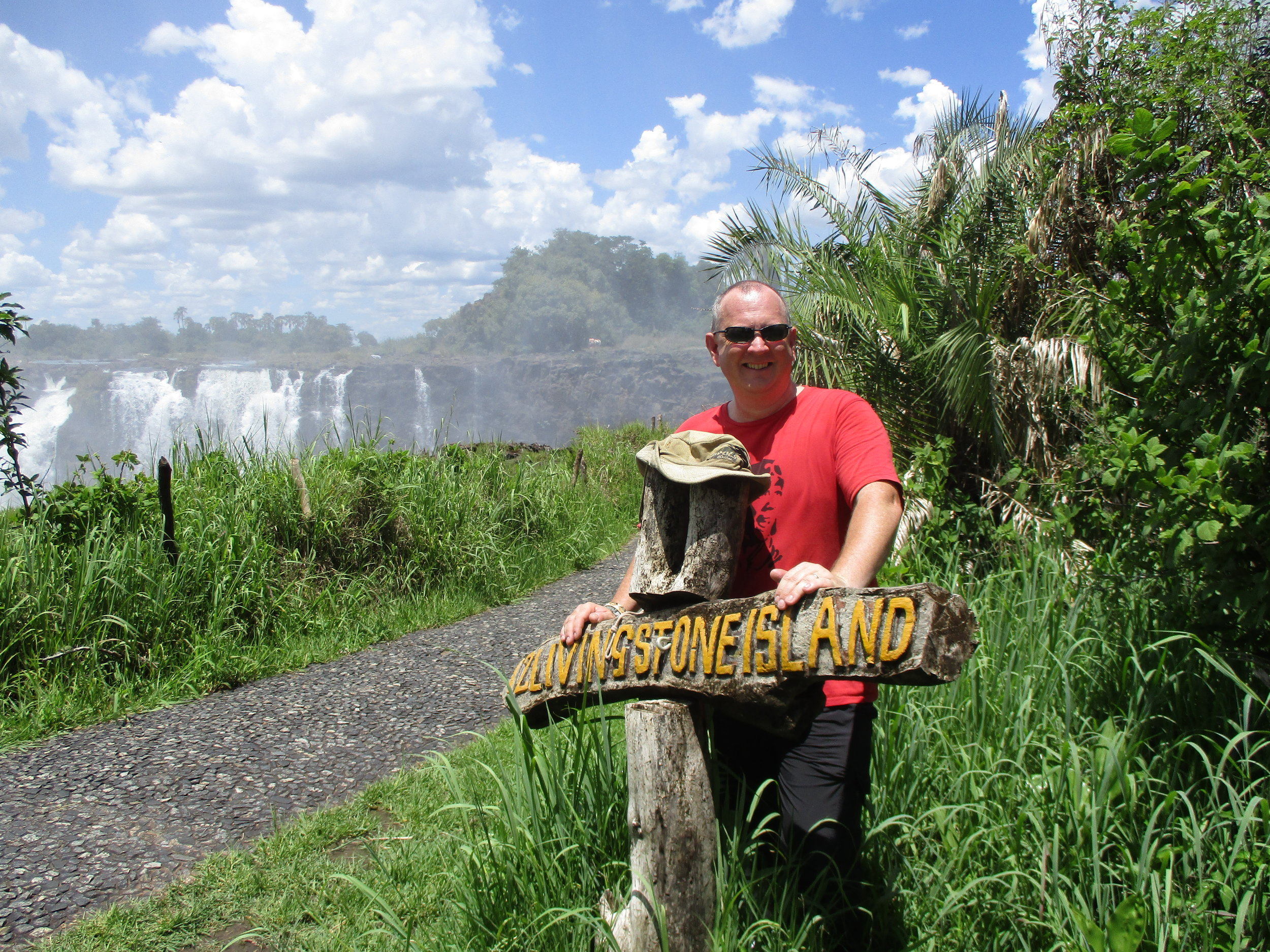 Pointing to Livingstone Island on the Zambia side 