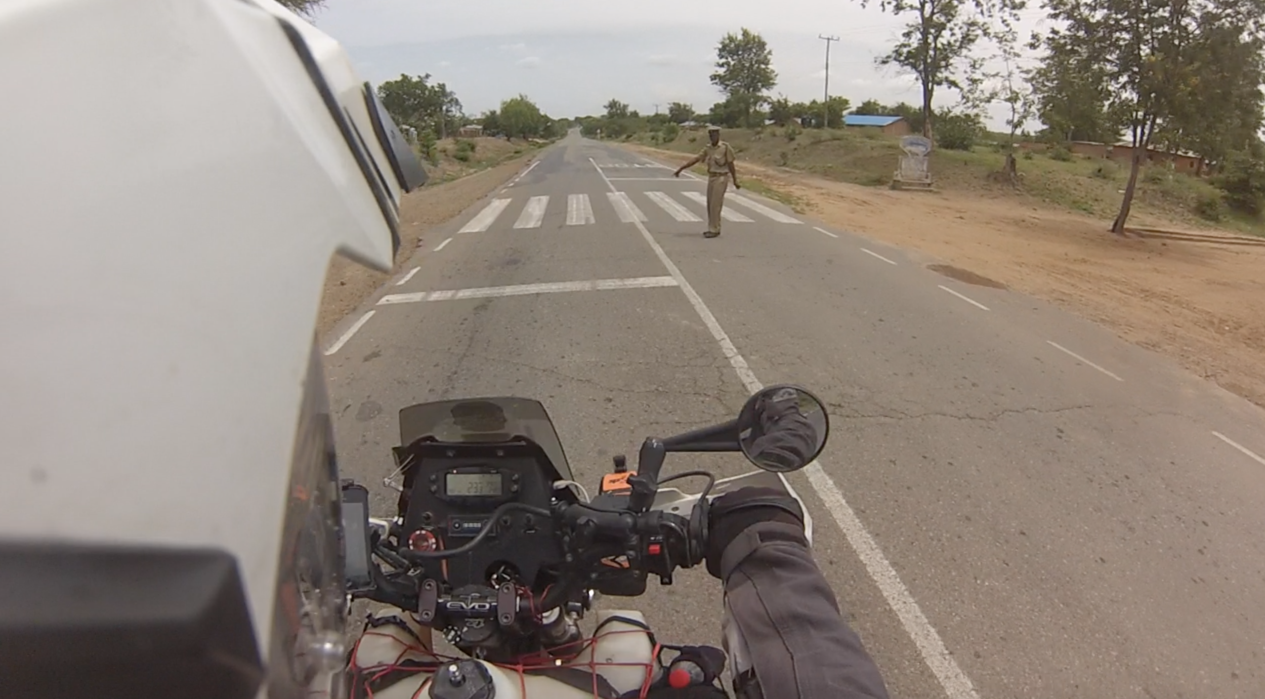 You be the judge. I pull up right where he's pointing, and he fines me for not stopping on the white line.