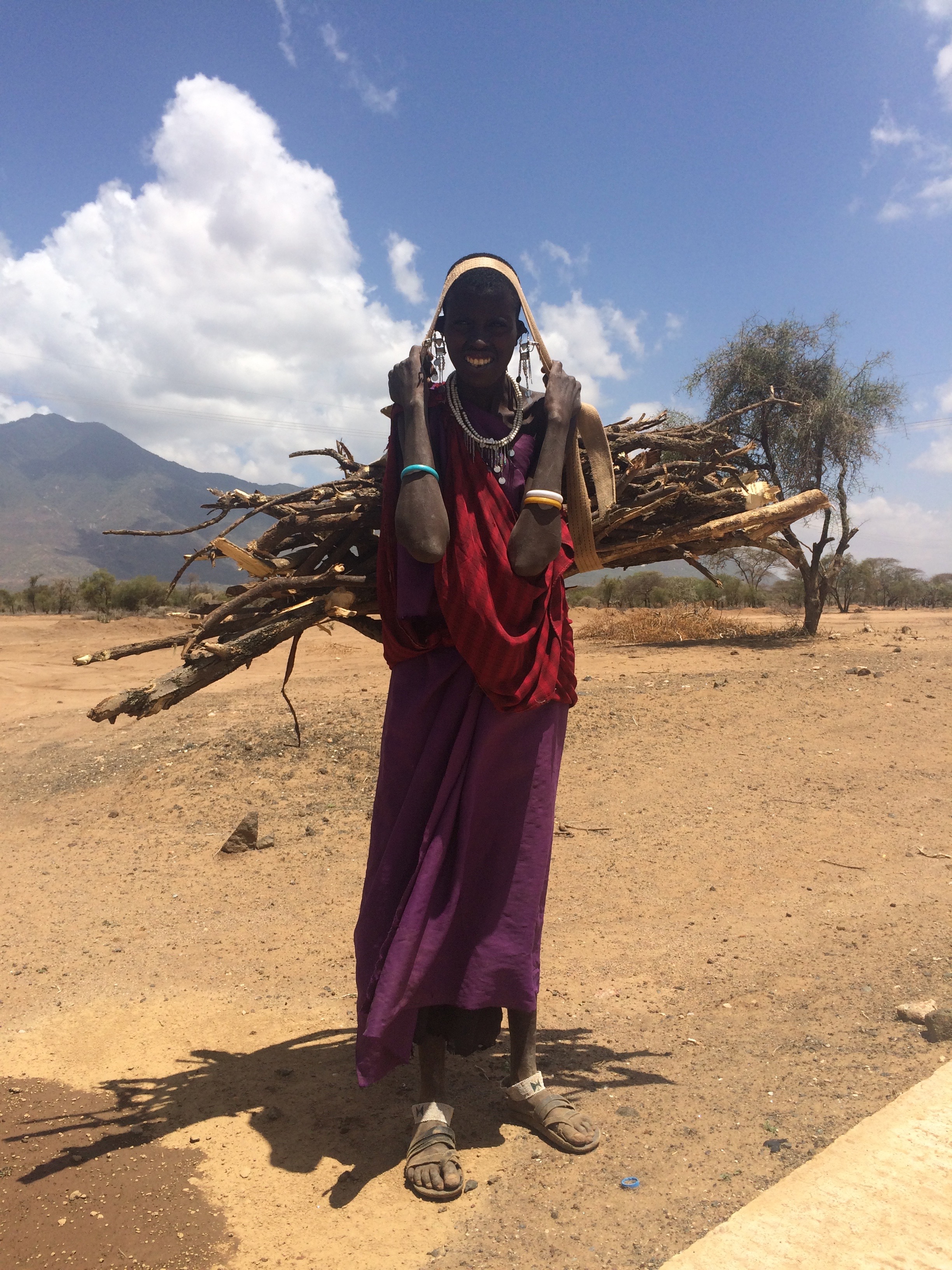 A Masai bushman collecting firewood