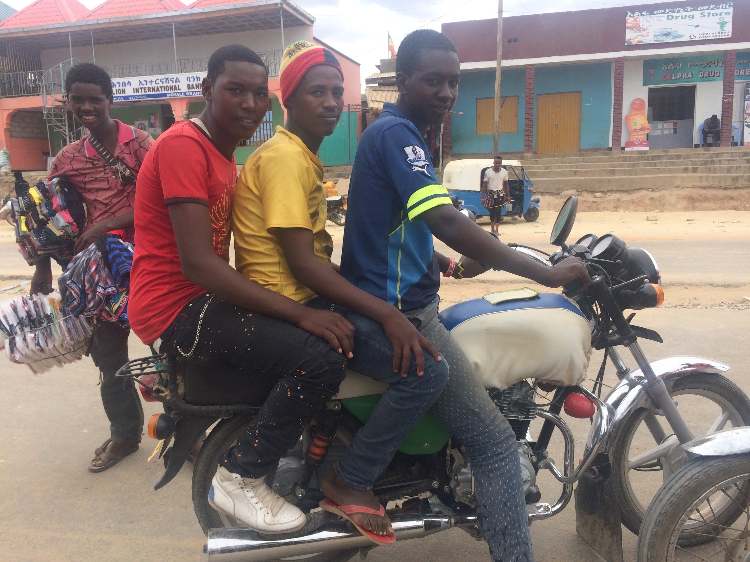 Local bikers come to check us out by customs. 