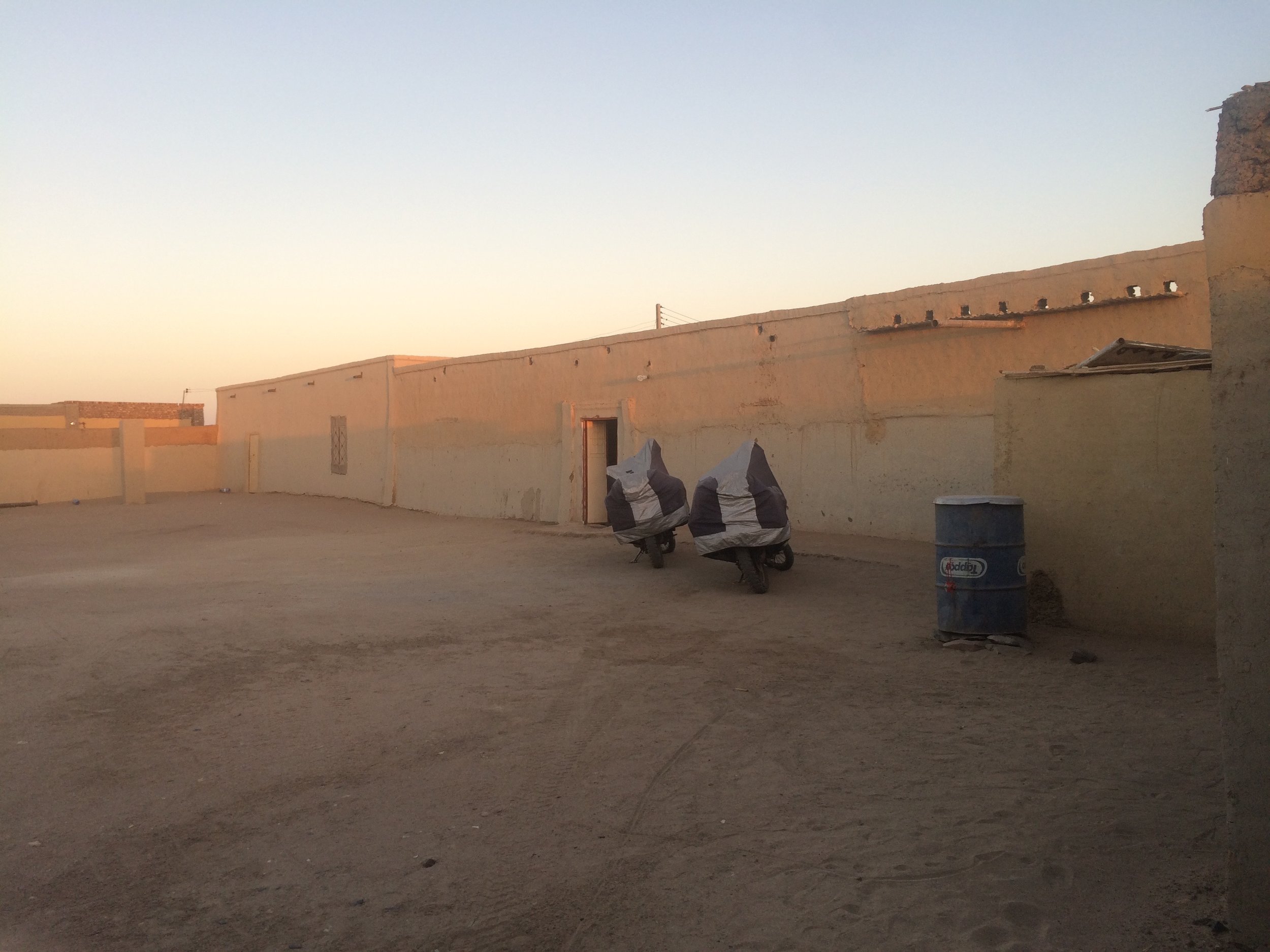 Soleb Guesthouse car park courtyard
