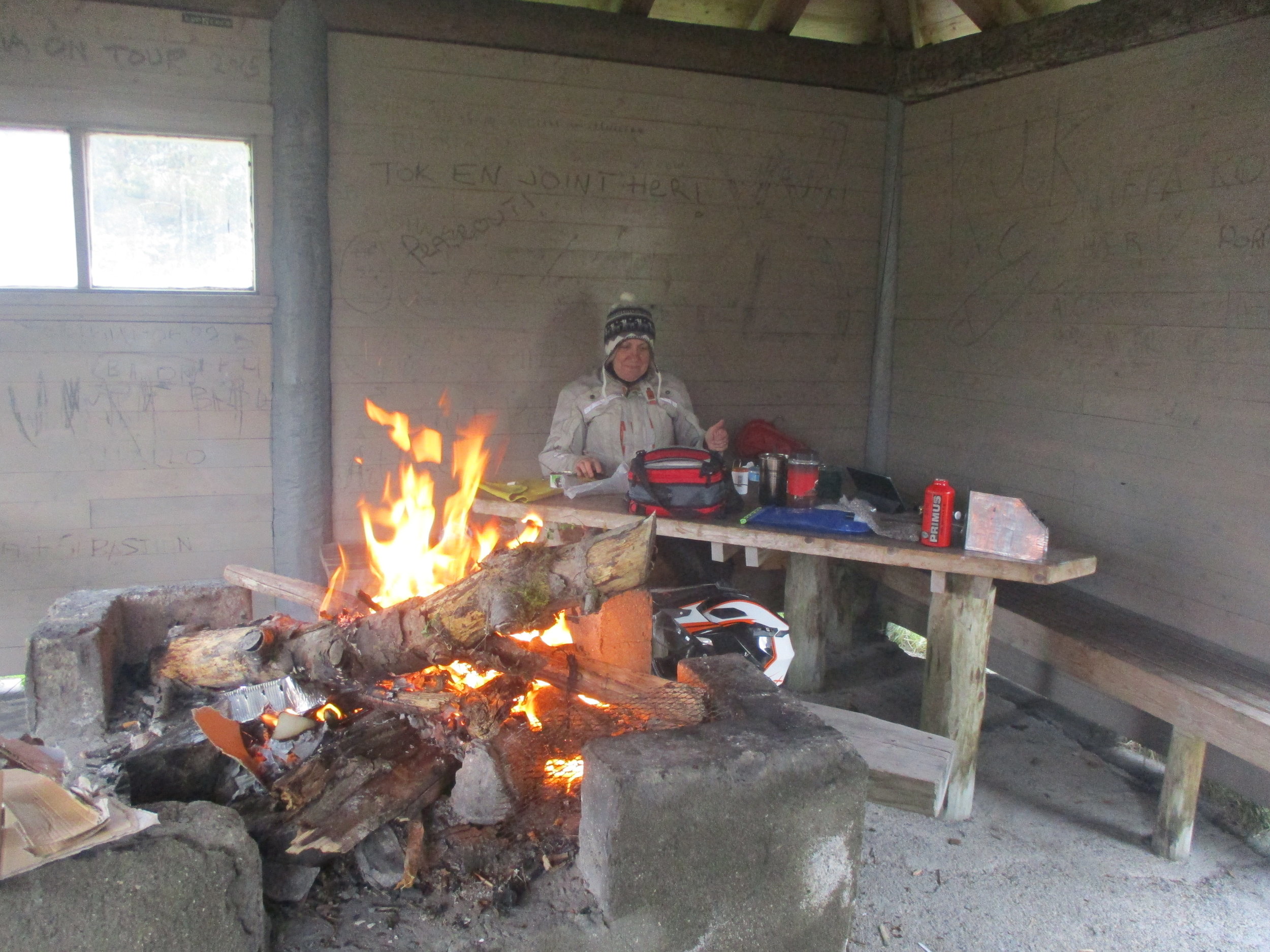 A picnic spot hut with a fire pit.