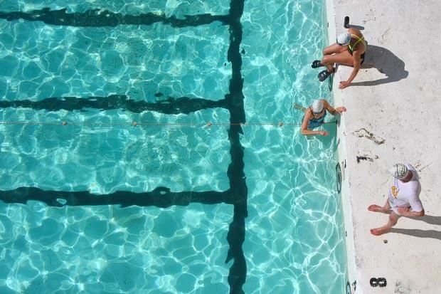 Swimmers Entering Blue Water At Icebergs Swimming Pool On Bondi Beach 