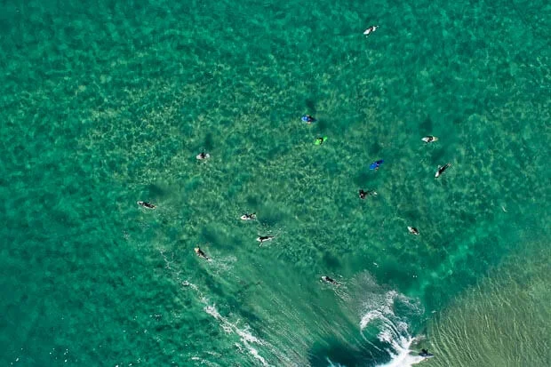 Beautiful Drone Photography: Tamarama Beach with Surfers In Crystal Clear Water