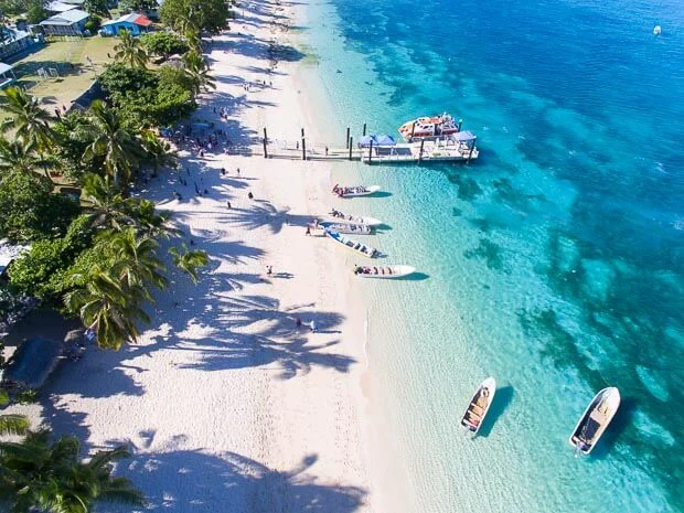 Fishing Boats Float In The Clear Waters Of Dravuni Island In Fiji