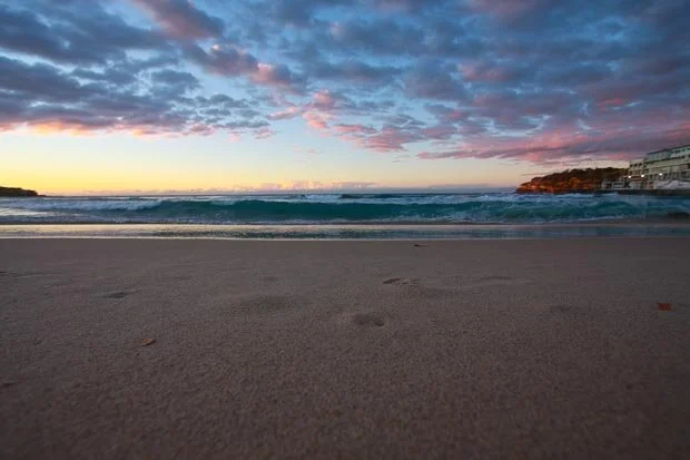 Beautiful Sunrise At Bondi Beach With Pink And Purple Clouds