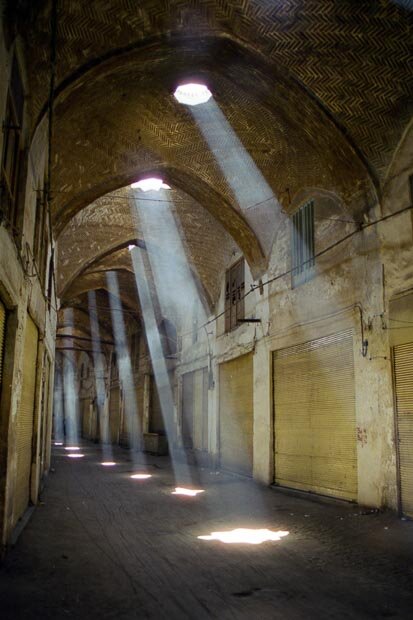 Light Shafts Shine Through The Ceiling Of The Esfahan Souk Markets At Midday Break In Iran 