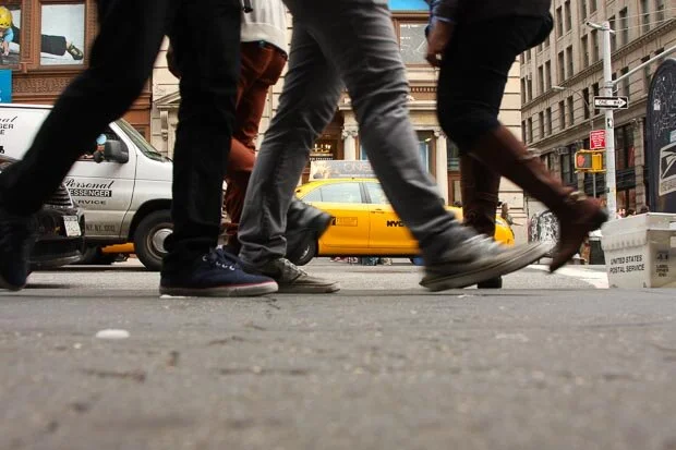 Pedestrians Walk By At Yellow Cab In Soho New York
