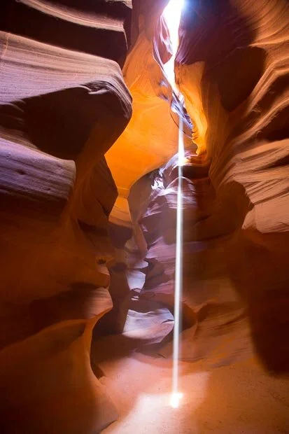 A Sharp White Light Beam Cuts Illuminates Antelope Canyon In Arizona